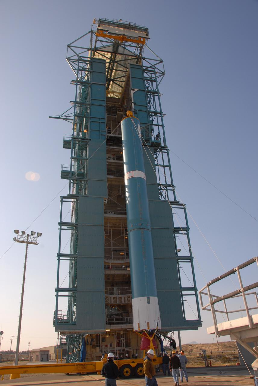 VANDENBERG AIR FORCE BASE, Calif. --  At Vandenberg Air Force Base in California, the Delta II first stage has been raised to a vertical position in front of the mobile service tower on Space Launch Complex 2.  Next, the first stage will be transferred into the tower. The Delta II is the launch vehicle for the OSTM/Jason-2 spacecraft.  The OSTM, or Ocean Topography Mission, on the Jason-2 satellite is a follow-on to Jason-1. It will take oceanographic studies of sea surface height into an operational mode for continued climate forecasting research and science and industrial applications.  This satellite altimetry data will help determine ocean circulation, climate change and sea-level rise. OSTM is a joint effort by the National Oceanic and Atmospheric Administration, NASA, France’s Centre National d’Etudes Spatiales and the European Meteorological Satellite Organisation. OSTM/Jason-2 will be launched aboard a United Launch Alliance Delta II 7320 from Vandenberg on June 15.  Photo credit: NASA/Dan Liberotti