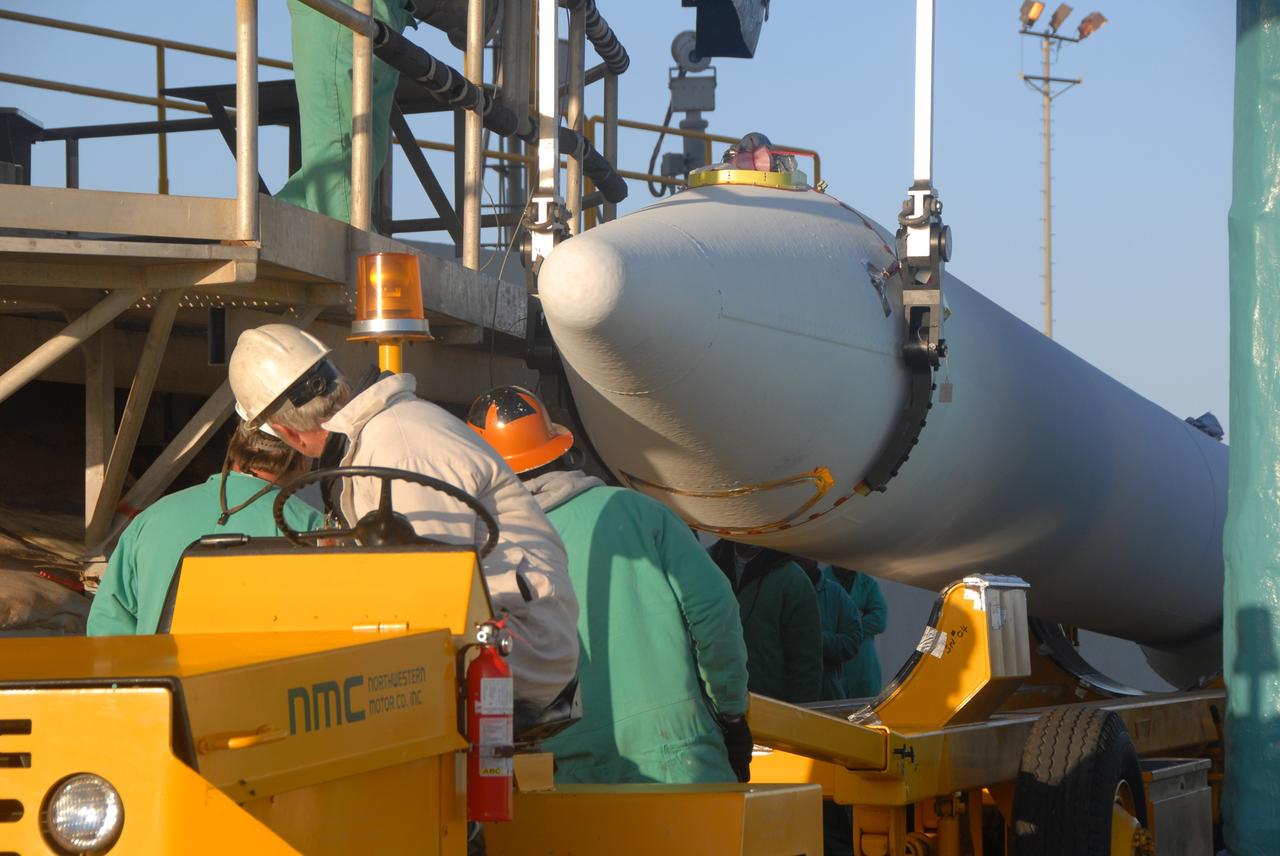 VANDENBERG AIR FORCE BASE, Calif. -- On Space Launch Complex 2 at Vandenberg Air Force Base in California, a solid rocket motor, or SRM, is raised from its transporter.  The SRM will be lifted into the mobile service tower and attached to the Delta II first stage inside the tower.  The Delta II is the launch vehicle for the OSTM/Jason-2 spacecraft.  The OSTM, or Ocean Topography Mission, on the Jason-2 satellite is a follow-on to Jason-1. It will take oceanographic studies of sea surface height into an operational mode for continued climate forecasting research and science and industrial applications.  This satellite altimetry data will help determine ocean circulation, climate change and sea-level rise. OSTM is a joint effort by the National Oceanic and Atmospheric Administration, NASA, France’s Centre National d’Etudes Spatiales and the European Meteorological Satellite Organisation. OSTM/Jason-2 will be launched aboard a United Launch Alliance Delta II 7320 from Vandenberg on June 15.  Photo credit: NASA/Dan Liberotti