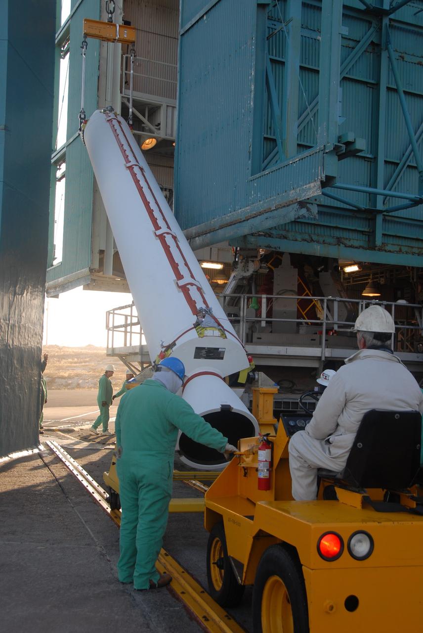 VANDENBERG AIR FORCE BASE, Calif. -- On Space Launch Complex 2 at Vandenberg Air Force Base in California, a solid rocket motor, or SRM, is raised from its transporter.  The SRM will be lifted into the mobile service tower and attached to the Delta II first stage inside the tower.  The Delta II is the launch vehicle for the OSTM/Jason-2 spacecraft. The OSTM, or Ocean Topography Mission, on the Jason-2 satellite is a follow-on to Jason-1. It will take oceanographic studies of sea surface height into an operational mode for continued climate forecasting research and science and industrial applications.  This satellite altimetry data will help determine ocean circulation, climate change and sea-level rise. OSTM is a joint effort by the National Oceanic and Atmospheric Administration, NASA, France’s Centre National d’Etudes Spatiales and the European Meteorological Satellite Organisation. OSTM/Jason-2 will be launched aboard a United Launch Alliance Delta II 7320 from Vandenberg on June 15.  Photo credit: NASA/Dan Liberotti