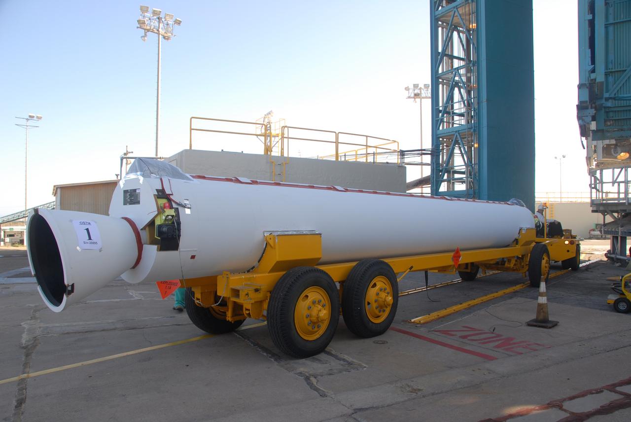 VANDENBERG AIR FORCE BASE, Calif. --   A second solid rocket motor, or SRM, to arrive on Space Launch Complex 2 at Vandenberg Air Force Base in California is moved into place for lifting into the mobile service tower.  The SRM will be attached to the Delta II first stage inside the tower.  The Delta II is the launch vehicle for the OSTM/Jason-2 spacecraft.  The OSTM, or Ocean Topography Mission, on the Jason-2 satellite is a follow-on to Jason-1. It will take oceanographic studies of sea surface height into an operational mode for continued climate forecasting research and science and industrial applications.  This satellite altimetry data will help determine ocean circulation, climate change and sea-level rise. OSTM is a joint effort by the National Oceanic and Atmospheric Administration, NASA, France’s Centre National d’Etudes Spatiales and the European Meteorological Satellite Organisation. OSTM/Jason-2 will be launched aboard a United Launch Alliance Delta II 7320 from Vandenberg on June 15.  Photo credit: NASA/Dan Liberotti