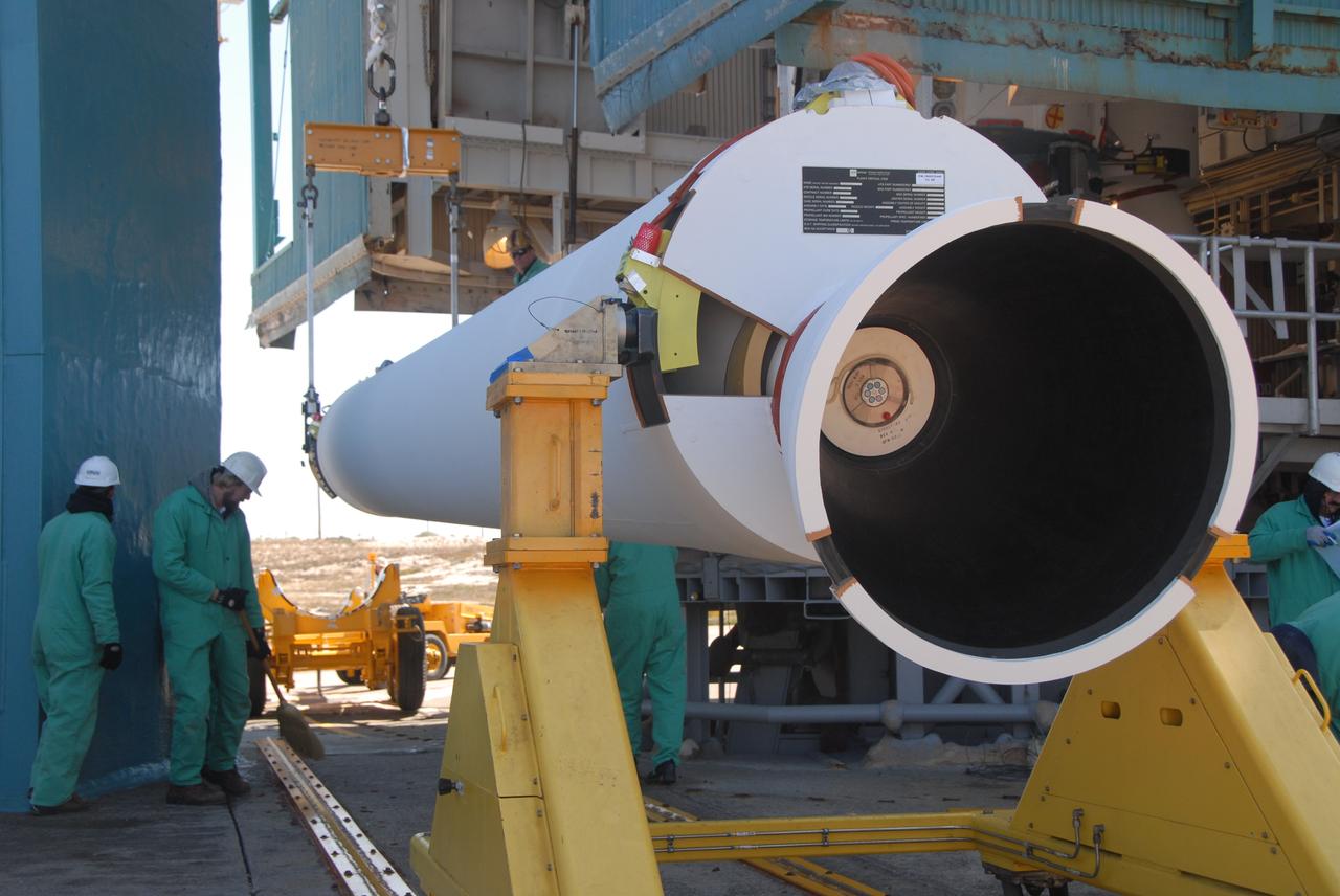 VANDENBERG AIR FORCE BASE, Calif. --  On Space Launch Complex 2 at Vandenberg Air Force Base in California, the second solid rocket motor, or SRM, is raised from its transporter. The SRM will be lifted into the mobile service tower and attached to the Delta II first stage inside the tower.  The Delta II is the launch vehicle for the OSTM/Jason-2 spacecraft.  The OSTM, or Ocean Topography Mission, on the Jason-2 satellite is a follow-on to Jason-1. It will take oceanographic studies of sea surface height into an operational mode for continued climate forecasting research and science and industrial applications.  This satellite altimetry data will help determine ocean circulation, climate change and sea-level rise. OSTM is a joint effort by the National Oceanic and Atmospheric Administration, NASA, France’s Centre National d’Etudes Spatiales and the European Meteorological Satellite Organisation. OSTM/Jason-2 will be launched aboard a United Launch Alliance Delta II 7320 from Vandenberg on June 15.  Photo credit: NASA/Dan Liberotti