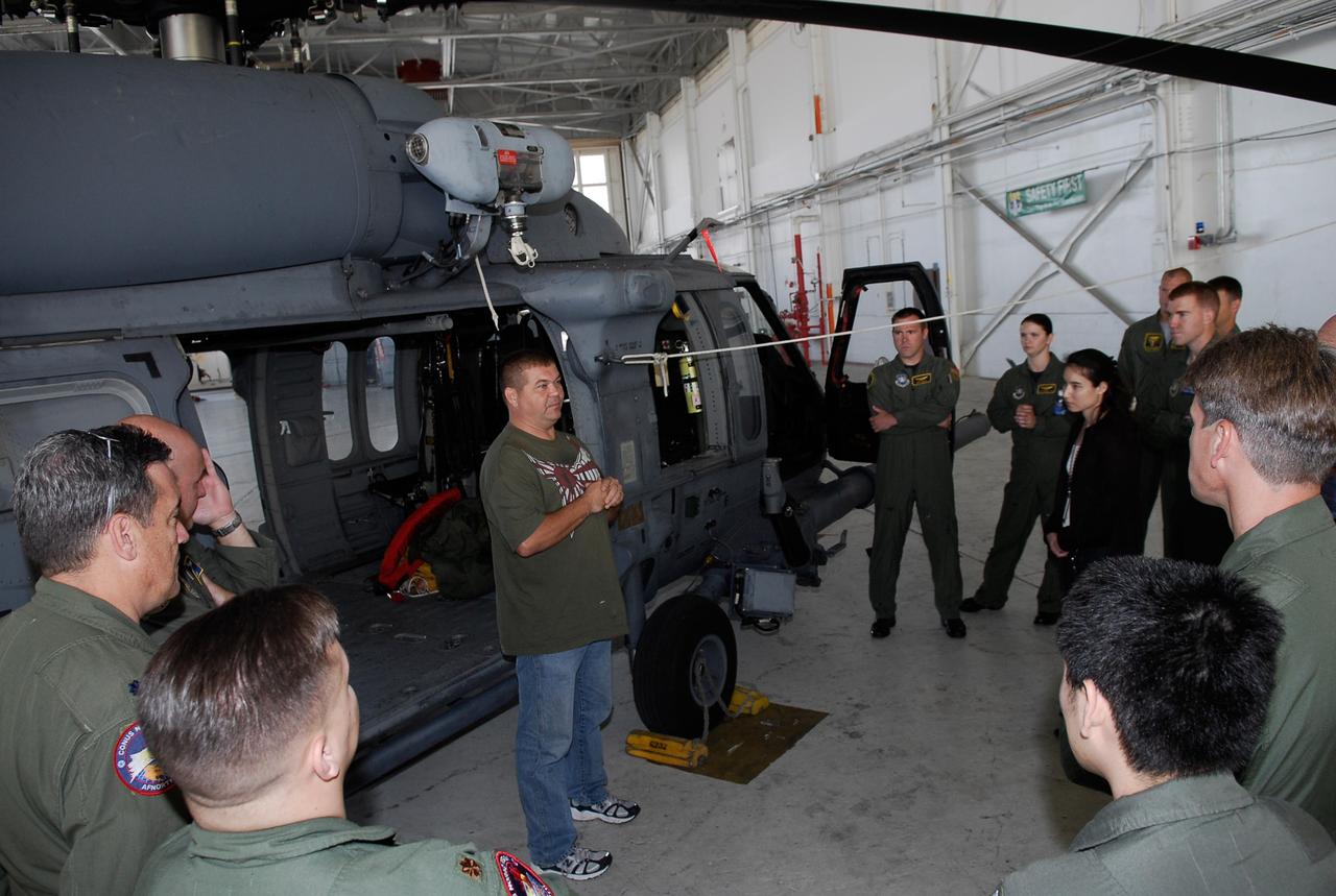 CAPE CANAVERAL, Fla. -- Participants in the Mode VIII exercise being conducted at Patrick Air Force Base, Fla., get instruction about the rescue equipment they will be working with. In support of, and with logistical support from, NASA, USSTRATCOM is hosting a major exercise involving Department of Defense, Department of Homeland Security, search and rescue (SAR) forces, including the 45th Space Wing at Patrick Air Force Base, which support space shuttle astronaut bailout contingency operations, known as Mode VIII.  This exercise tests SAR capabilities to locate, recover and provide medical treatment for astronauts following a space shuttle launch phase open-ocean bailout. Participants include members of the U.S. Navy, U.S. Coast Guard, U.S. Air Force, and NASA's Kennedy Space Center and Johnson Space Center.  This will be the 15th Mode VIII exercise conducted in the past 20 years.  Photo credit: NASA/Kim Shiflett