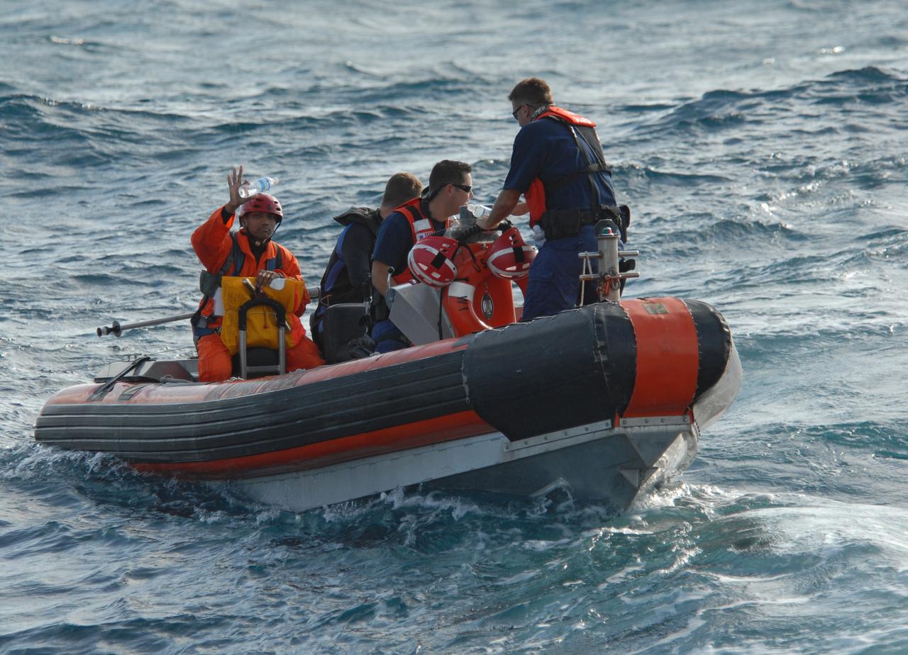 CAPE CANAVERAL, Fla. -- Participants in a rescue training exercise, known as Mode VIII, are successfully launched from a U.S. Coast Guard rescue boat off Florida's central east coast. In support of, and with logistical support from, NASA, USSTRATCOM is hosting a major exercise involving Department of Defense, Department of Homeland Security, search and rescue (SAR) forces, including the 45th Space Wing at Patrick Air Force Base, which support space shuttle astronaut bailout contingency operations, known as Mode VIII. This exercise tests SAR capabilities to locate, recover and provide medical treatment for astronauts following a space shuttle launch phase open-ocean bailout. Participants include members of the U.S. Navy, U.S. Coast Guard, U.S. Air Force, and NASA's Kennedy Space Center and Johnson Space Center. Photo credit: NASA/Dimitri Gerondidakis