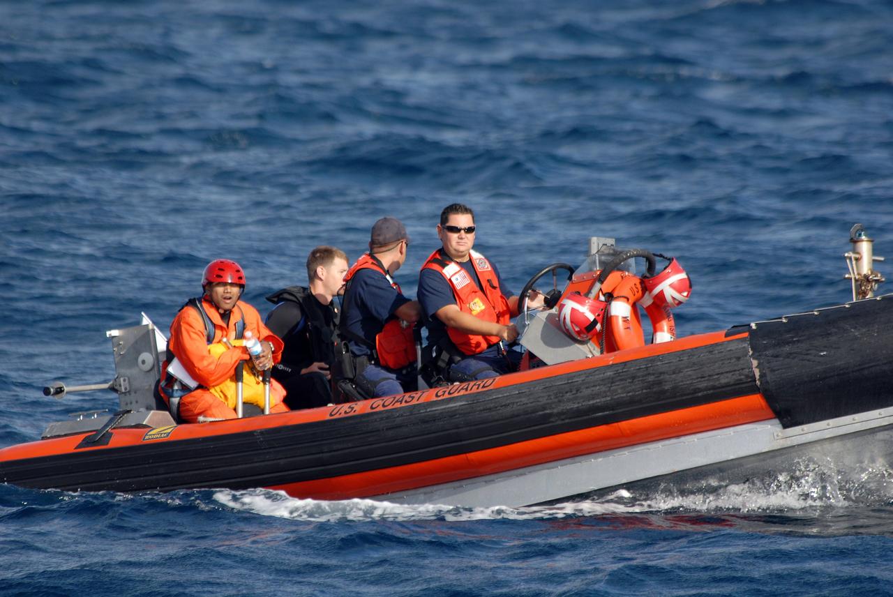 CAPE CANAVERAL, Fla. -- Participants in a rescue training exercise, known as Mode VIII, are successfully launched from a U.S. Coast Guard rescue boat off Florida's central east coast. In support of, and with logistical support from, NASA, USSTRATCOM is hosting a major exercise involving Department of Defense, Department of Homeland Security, search and rescue (SAR) forces, including the 45th Space Wing at Patrick Air Force Base, which support space shuttle astronaut bailout contingency operations, known as Mode VIII. This exercise tests SAR capabilities to locate, recover and provide medical treatment for astronauts following a space shuttle launch phase open-ocean bailout. Participants include members of the U.S. Navy, U.S. Coast Guard, U.S. Air Force, and NASA's Kennedy Space Center and Johnson Space Center. Photo credit: NASA/Dimitri Gerondidakis