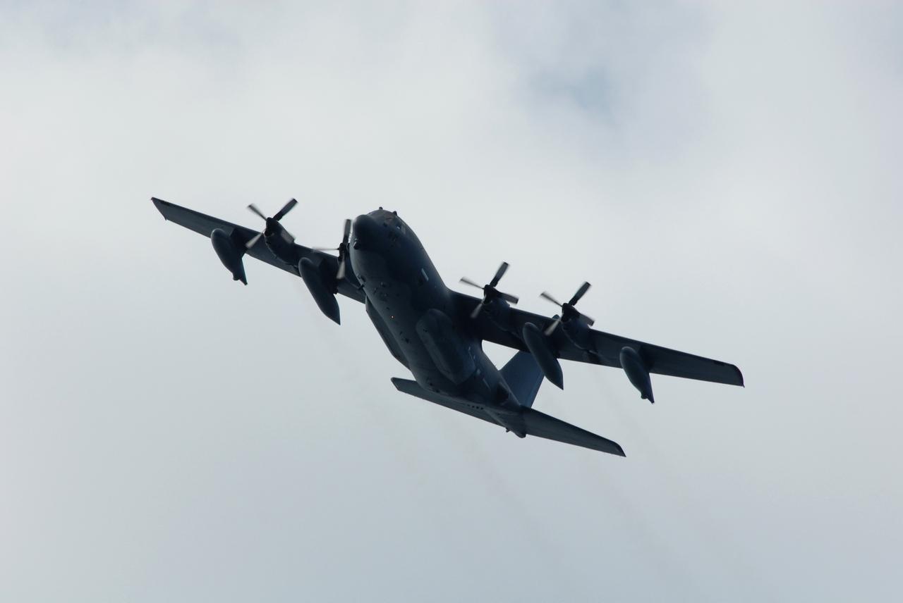 CAPE CANAVERAL, Fla. -- An Air Force HC-130 rescue tanker flies over the target area off Florida's central east coast during a rescue training exercise, known as Mode VIII. In support of, and with logistical support from, NASA, USSTRATCOM is hosting a major exercise involving Department of Defense, Department of Homeland Security, search and rescue (SAR) forces, including the 45th Space Wing at Patrick Air Force Base, which support space shuttle astronaut bailout contingency operations, known as Mode VIII. This exercise tests SAR capabilities to locate, recover and provide medical treatment for astronauts following a space shuttle launch phase open-ocean bailout. Participants include members of the U.S. Navy, U.S. Coast Guard, U.S. Air Force, and NASA's Kennedy Space Center and Johnson Space Center. Photo credit: NASA/Dimitri Gerondidakis