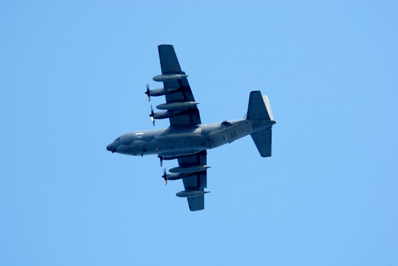 CAPE CANAVERAL, Fla. -- An Air Force HC-130 rescue tanker flies over the target area off Florida's central east coast during a rescue training exercise, known as Mode VIII. In support of, and with logistical support from, NASA, USSTRATCOM is hosting a major exercise involving Department of Defense, Department of Homeland Security, search and rescue (SAR) forces, including the 45th Space Wing at Patrick Air Force Base, which support space shuttle astronaut bailout contingency operations, known as Mode VIII. This exercise tests SAR capabilities to locate, recover and provide medical treatment for astronauts following a space shuttle launch phase open-ocean bailout. Participants include members of the U.S. Navy, U.S. Coast Guard, U.S. Air Force, and NASA's Kennedy Space Center and Johnson Space Center. Photo credit: NASA/Dimitri Gerondidakis