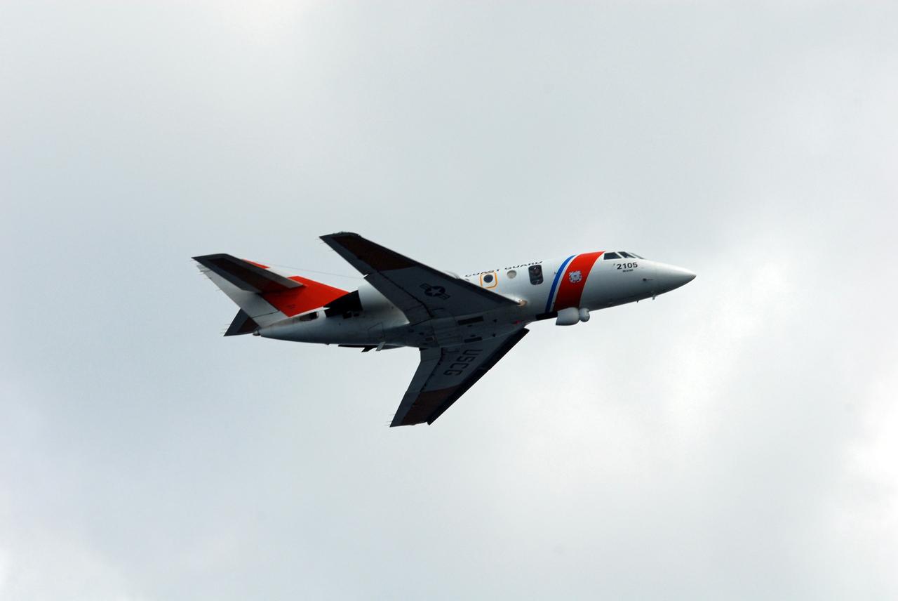 CAPE CANAVERAL, Fla. -- A U.S. Coast Guard HU-25 Falcon jet flies overhead during a rescue training exercise, known as Mode VIII, off Florida's central east coast. In support of, and with logistical support from, NASA, USSTRATCOM is hosting a major exercise involving Department of Defense, Department of Homeland Security, search and rescue (SAR) forces, including the 45th Space Wing at Patrick Air Force Base, which support space shuttle astronaut bailout contingency operations, known as Mode VIII. This exercise tests SAR capabilities to locate, recover and provide medical treatment for astronauts following a space shuttle launch phase open-ocean bailout. Participants include members of the U.S. Navy, U.S. Coast Guard, U.S. Air Force, and NASA's Kennedy Space Center and Johnson Space Center. Photo credit: NASA/Dimitri Gerondidakis