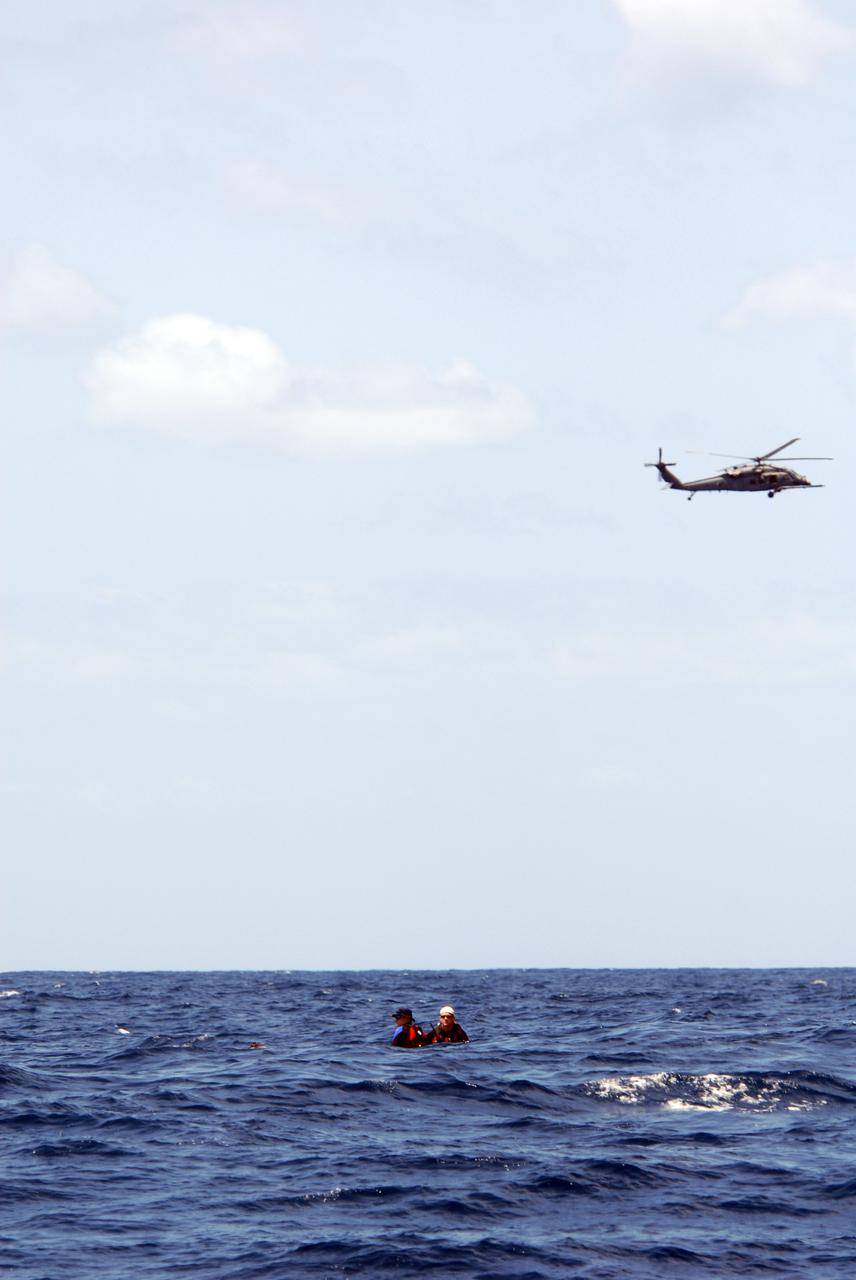 CAPE CANAVERAL, Fla. -- Participants in a rescue training exercise, known as Mode VIII, wait for a support boat off Florida's central east coast. In support of, and with logistical support from, NASA, USSTRATCOM is hosting a major exercise involving Department of Defense, Department of Homeland Security, search and rescue (SAR) forces, including the 45th Space Wing at Patrick Air Force Base, which support space shuttle astronaut bailout contingency operations, known as Mode VIII. This exercise tests SAR capabilities to locate, recover and provide medical treatment for astronauts following a space shuttle launch phase open-ocean bailout. Participants include members of the U.S. Navy, U.S. Coast Guard, U.S. Air Force, and NASA's Kennedy Space Center and Johnson Space Center. Photo credit: NASA/Dimitri Gerondidakis