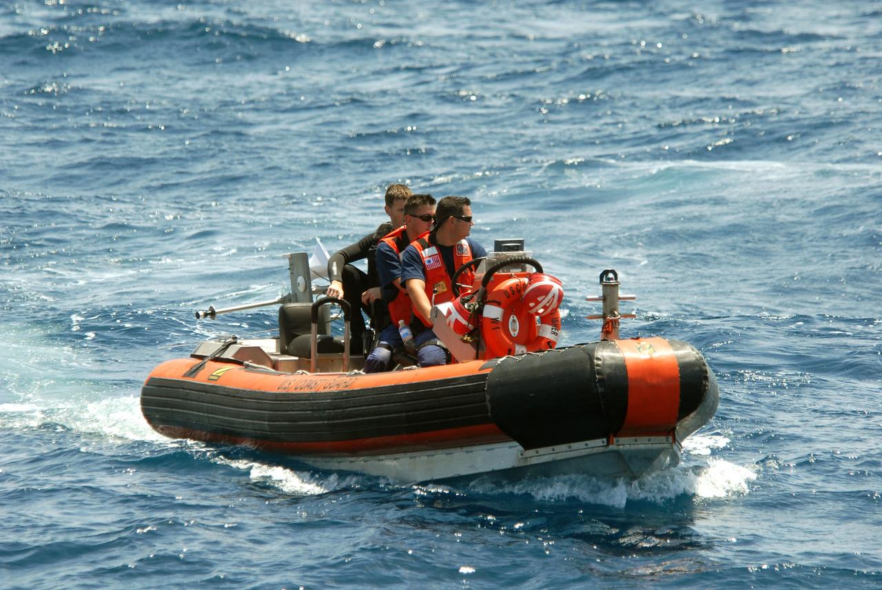 CAPE CANAVERAL, Fla. -- Off Florida's central east coast, a support boat from a rescue training exercise, known as Mode VIII, returns to the Freedom Star, one of NASA's solid rocket booster retrieval ships from NASA's Kennedy Space Center. In support of, and with logistical support from, NASA, USSTRATCOM is hosting a major exercise involving Department of Defense, Department of Homeland Security, search and rescue (SAR) forces, including the 45th Space Wing at Patrick Air Force Base, which support space shuttle astronaut bailout contingency operations, known as Mode VIII. This exercise tests SAR capabilities to locate, recover and provide medical treatment for astronauts following a space shuttle launch phase open-ocean bailout. Participants include members of the U.S. Navy, U.S. Coast Guard, U.S. Air Force, and NASA's Kennedy Space Center and Johnson Space Center. Photo credit: NASA/Dimitri Gerondidakis