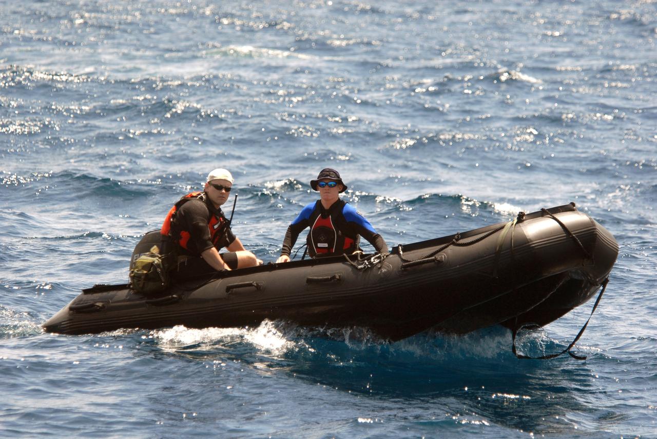 CAPE CANAVERAL, Fla. -- A support boat from a rescue training exercise, known as Mode VIII, returns to the ship off Florida's central east coast. In support of, and with logistical support from, NASA, USSTRATCOM is hosting a major exercise involving Department of Defense, Department of Homeland Security, search and rescue (SAR) forces, including the 45th Space Wing at Patrick Air Force Base, which support space shuttle astronaut bailout contingency operations, known as Mode VIII. This exercise tests SAR capabilities to locate, recover and provide medical treatment for astronauts following a space shuttle launch phase open-ocean bailout. Participants include members of the U.S. Navy, U.S. Coast Guard, U.S. Air Force, and NASA's Kennedy Space Center and Johnson Space Center. Photo credit: NASA/Dimitri Gerondidakis