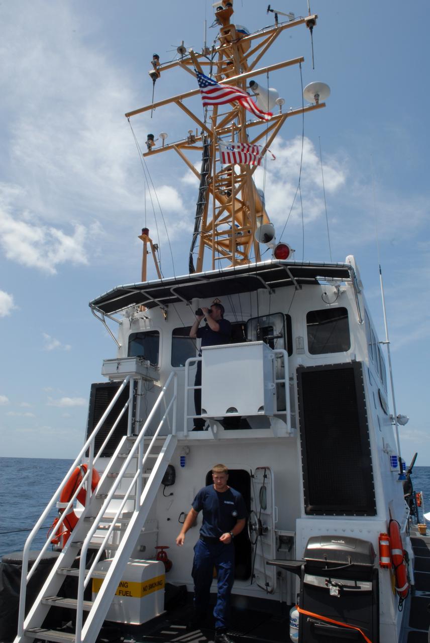 CAPE CANAVERAL, Fla. -- Off Florida's central east coast, members of the rescue team in a training exercise, known as Mode VIII, stay alert aboard the U.S. Coast Guard cutter Kingfisher, from Port Canaveral, Fla. In support of, and with logistical support from, NASA, USSTRATCOM is hosting a major exercise involving Department of Defense, Department of Homeland Security, search and rescue (SAR) forces, including the 45th Space Wing at Patrick Air Force Base, which support space shuttle astronaut bailout contingency operations, known as Mode VIII. This exercise tests SAR capabilities to locate, recover and provide medical treatment for astronauts following a space shuttle launch phase open-ocean bailout. Participants include members of the U.S. Navy, U.S. Coast Guard, U.S. Air Force, and NASA's Kennedy Space Center and Johnson Space Center. Photo credit: NASA/Dimitri Gerondidakis