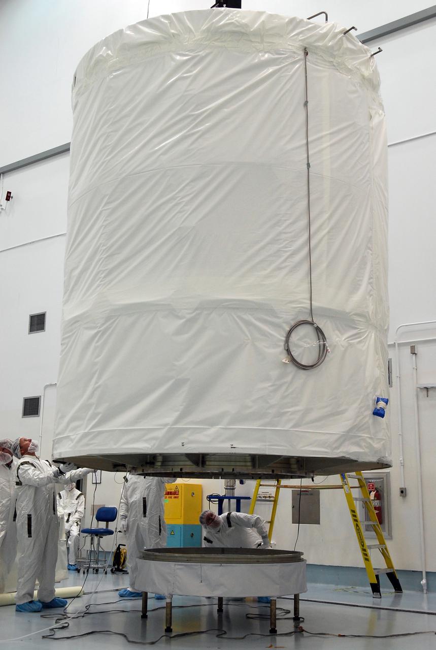 CAPE CANAVERAL, Fla. --   At Astrotech in Titusville, Fla., the GLAST spacecraft, inside its payload transportation canister, is lifted from its stand.  It will be moved to a transporter for transfer to pad 17-B at Cape Canaveral Air Force Station. At the pad, NASA's Gamma-Ray Large Area Space Telescope will be lifted into the mobile service tower and encapsulated in the fairing for launch.  GLAST  is a powerful space observatory that will explore the Universe's ultimate frontier, where nature harnesses forces and energies far beyond anything possible on Earth;  probe some of science's deepest questions, such as what our Universe is made of, and search for new laws of physics; explain how black holes accelerate jets of material to nearly light speed; and help crack the mystery of stupendously powerful explosions known as gamma-ray bursts. The launch date is targeted no earlier than June 3.   Photo credit: NASA/Kim Shiflett