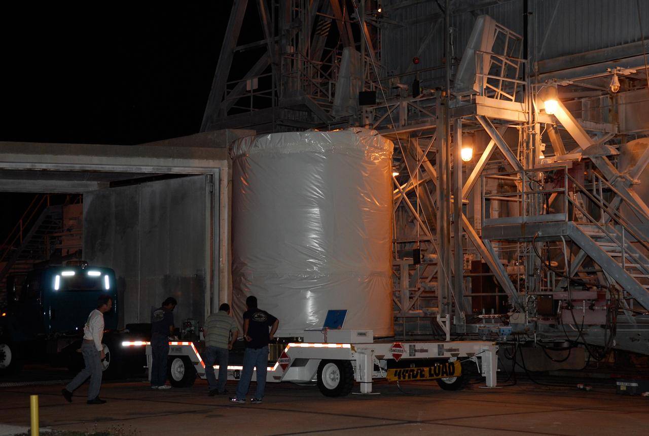 CAPE CANAVERAL, Fla. --  The GLAST spacecraft arrives at pad 17-B at Cape Canaveral Air Force Station aboard its transporter. At the pad, NASA's Gamma-Ray Large Area Space Telescope will be lifted into the mobile service tower and attached to the Delta II second stage.  GLAST  is a powerful space observatory that will explore the Universe's ultimate frontier, where nature harnesses forces and energies far beyond anything possible on Earth;  probe some of science's deepest questions, such as what our Universe is made of, and search for new laws of physics; explain how black holes accelerate jets of material to nearly light speed; and help crack the mystery of stupendously powerful explosions known as gamma-ray bursts. The launch date is targeted no earlier than June 3.   Photo credit: NASA/Kim Shiflett