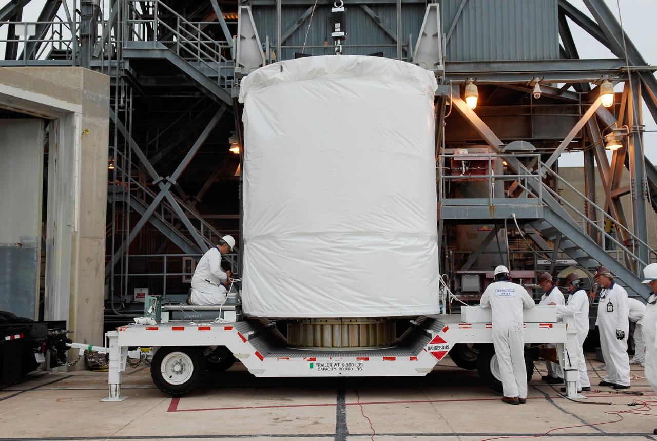 CAPE CANAVERAL, Fla. --  At pad 17-B at Cape Canaveral Air Force Station, workers secure the lines of the hoist that will lift the GLAST spacecraft into the mobile service tower. In the tower, GLAST will be mated with the Delta II second stage.  GLAST  is a powerful space observatory that will explore the Universe's ultimate frontier, where nature harnesses forces and energies far beyond anything possible on Earth;  probe some of science's deepest questions, such as what our Universe is made of, and search for new laws of physics; explain how black holes accelerate jets of material to nearly light speed; and help crack the mystery of stupendously powerful explosions known as gamma-ray bursts. The launch date is targeted no earlier than June 3.   Photo credit: NASA/Kim Shiflett