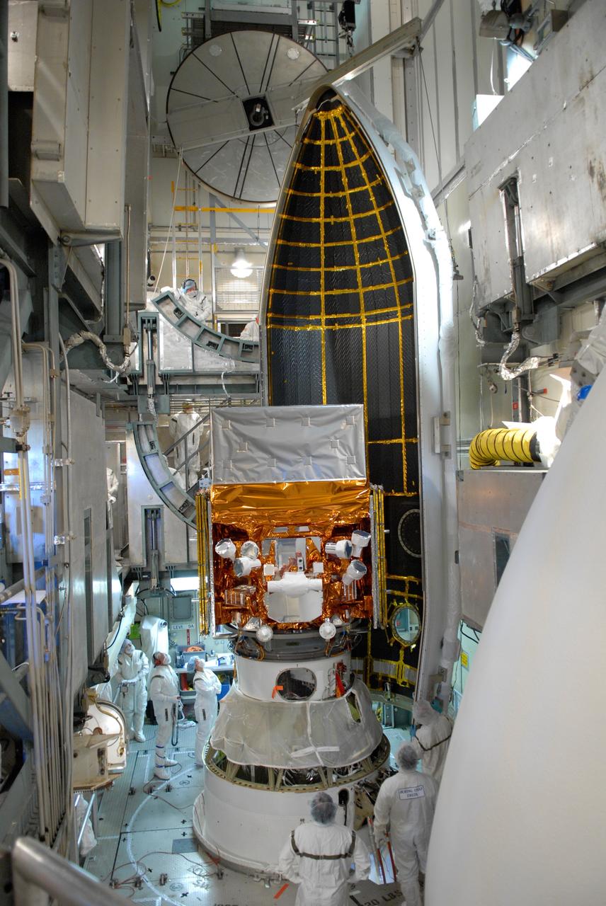 CAPE CANAVERAL, Fla. --  The first half of the payload fairing is ready to be moved around NASA's Gamma-Ray Large Area Space Telescope, or GLAST, within the mobile service tower on Launch Pad 17-B at Cape Canaveral Air Force Station.  The fairing is a molded structure that fits flush with the outside surface of the Delta II upper stage booster and forms an aerodynamically smooth nose cone, protecting the spacecraft during launch and ascent. GLAST  is a powerful space observatory that will explore the Universe's ultimate frontier, where nature harnesses forces and energies far beyond anything possible on Earth;  probe some of science's deepest questions, such as what our Universe is made of, and search for new laws of physics; explain how black holes accelerate jets of material to nearly light speed; and help crack the mystery of stupendously powerful explosions known as gamma-ray bursts. The launch date is targeted no earlier than June 3. Photo credit: NASA/Jim Grossmann