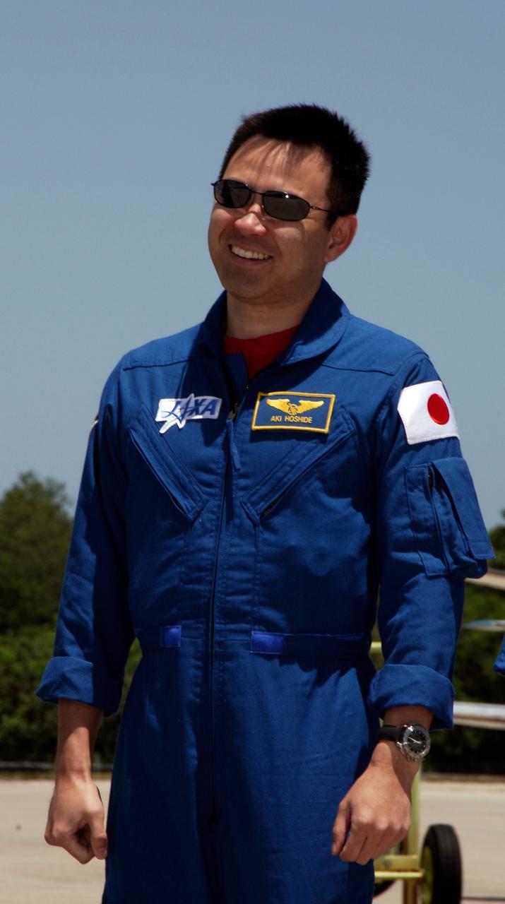 CAPE CANAVERAL, Fla. -- The crew of space shuttle Discovery's STS-124 mission gathers on the Shuttle Landing Facility at NASA's Kennedy Space Center after their arrival aboard T-38 jet trainers to prepare for launch. Seen here is Mission Specialist Akihiko Hoshide, who represents the Japan Aerospace Exploration Agency. Launch of Discovery is scheduled for 5:02 p.m. May 31. On the STS-124 mission, the crew of seven will deliver and install the Japanese Experiment Module – Pressurized Module and Japanese Remote Manipulator System. Photo credit: NASA/Kim Shiflett