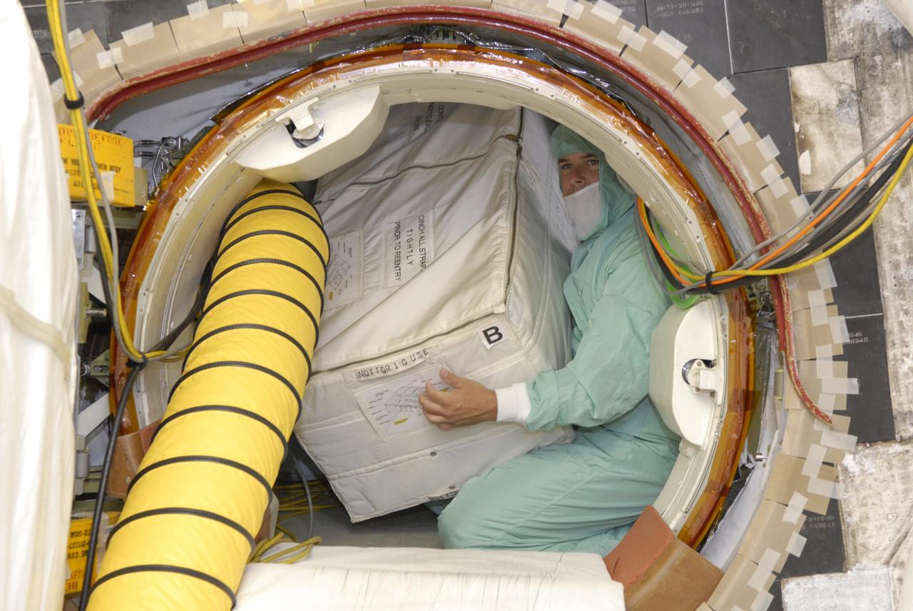 CAPE CANAVERAL, Fla. -- At Launch Pad 39A at Kennedy Space Center, a technician loads replacement parts for the Zvezda service module toilet on the International Space Station aboard space shuttle Discovery. The toilet malfunctioned last week and was initially repaired by replacing a microprocessor valve. After the station crew members experienced additional difficulties with the toilet, they were directed to use Soyuz toilet facilities at first and are using the main toilet again after rigging a urine bypass. The spare toilet parts have been added to Discovery’s manifest for delivery to the station on the STS-124 mission. On the 14-day mission, Discovery and its crew will deliver the Japan Aerospace Exploration Agency's Japanese Experiment Module – Pressurized Module and the Japanese Remote Manipulator System. Launch is scheduled for 5:02 p.m. EDT May 31. Photo credit: NASA/Dimitri Gerondidakis