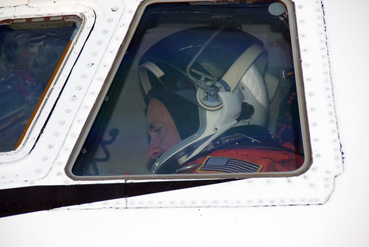 CAPE CANAVERAL, Fla. -- On the Shuttle Landing Facility at NASA's Kennedy Space Center, the commander of the STS-124 mission, Mark Kelly, sits in the cockpit of the shuttle training aircraft, or STA. He is getting ready to practice landing the shuttle on the SLF runway. The STA is a Grumman American Aviation-built Gulf Stream II jet that was modified to simulate an orbiter's cockpit, motion and visual cues, and handling qualities. In flight, the aircraft duplicates the orbiter's atmospheric descent trajectory from approximately 35,000 feet altitude to landing on a runway. Space shuttle Discovery is scheduled to lift off on the STS-124 mission at 5:02 p.m. May 31. Photo credit: NASA/Kim Shiflett