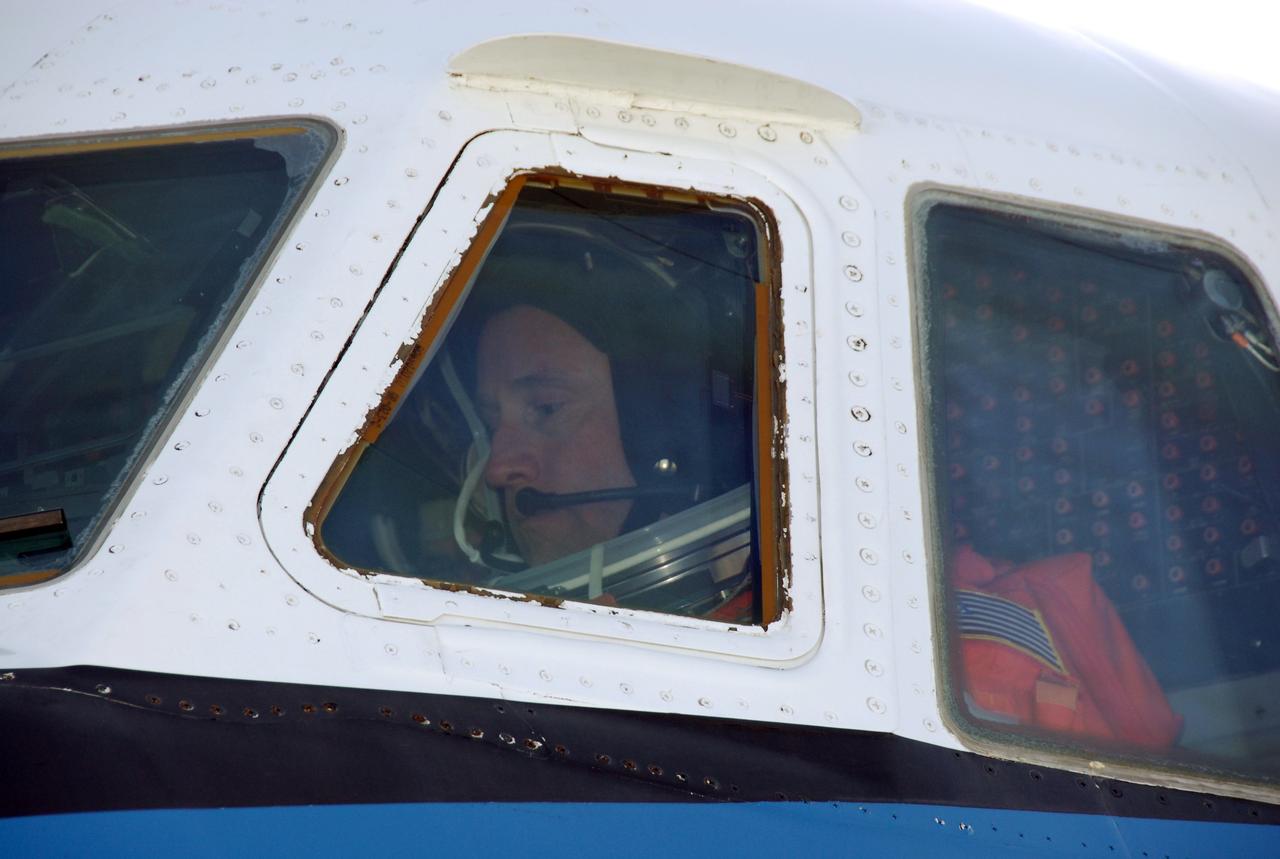 CAPE CANAVERAL, Fla. -- On the Shuttle Landing Facility at NASA's Kennedy Space Center, the commander of the STS-124 mission, Mark Kelly, sits in the cockpit of the shuttle training aircraft, or STA. He is getting ready to practice landing the shuttle on the SLF runway. The STA is a Grumman American Aviation-built Gulf Stream II jet that was modified to simulate an orbiter's cockpit, motion and visual cues, and handling qualities. In flight, the aircraft duplicates the orbiter's atmospheric descent trajectory from approximately 35,000 feet altitude to landing on a runway. Space shuttle Discovery is scheduled to lift off on the STS-124 mission at 5:02 p.m. May 31. Photo credit: NASA/Kim Shiflett