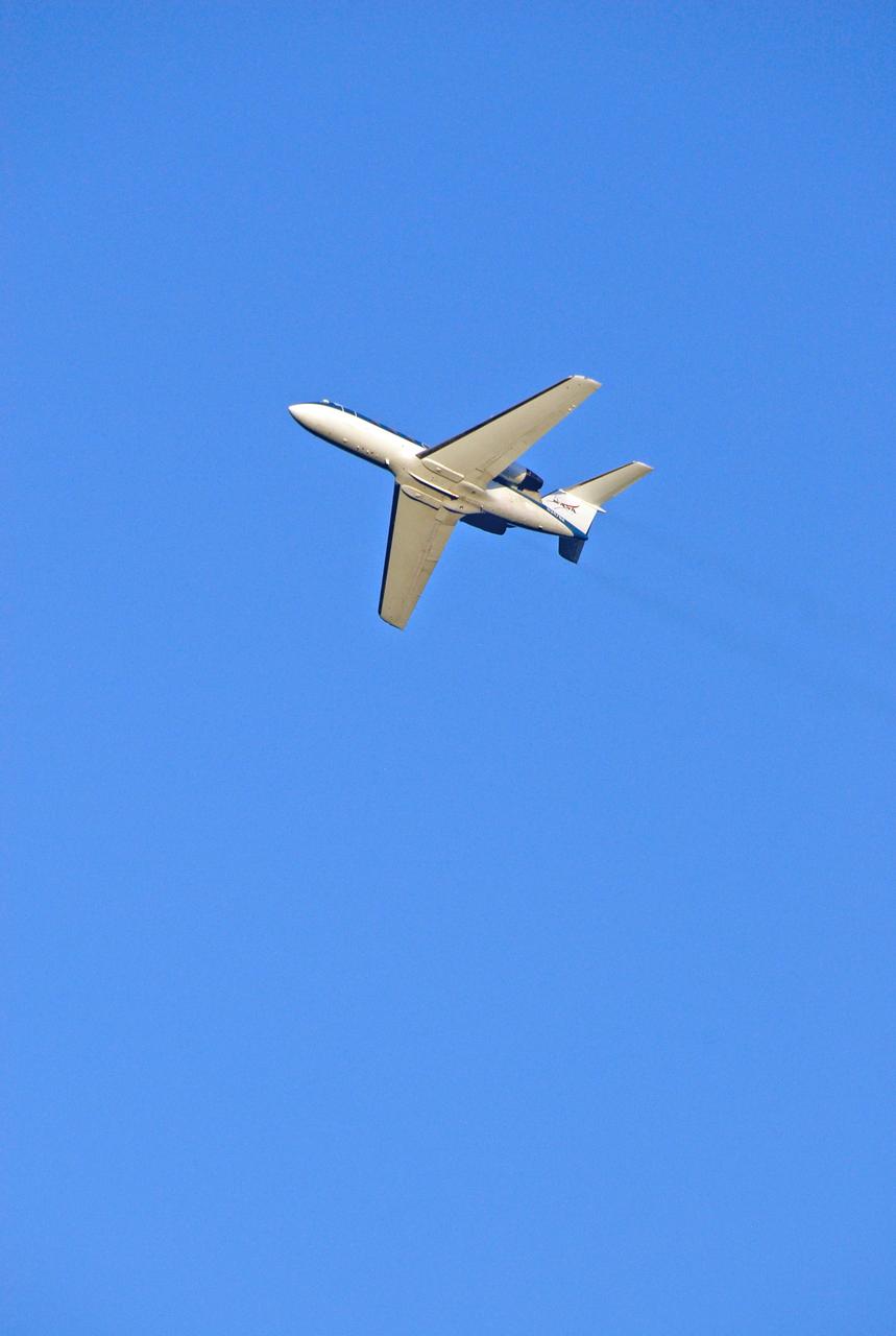 CAPE CANAVERAL, Fla. -- One of the shuttle training aircraft, or STA, flies over NASA Kennedy Space Center's Shuttle Landing Facility during landing practice. The commander and pilot of the STS-124 mission, Mark Kelly and Ken Ham, are making the practice landings. The STA is a Grumman American Aviation-built Gulf Stream II jet that was modified to simulate an orbiter's cockpit, motion and visual cues, and handling qualities. In flight, the aircraft duplicates the orbiter's atmospheric descent trajectory from approximately 35,000 feet altitude to landing on a runway. Space shuttle Discovery is scheduled to lift off on the STS-124 mission at 5:02 p.m. May 31. Photo credit: NASA/Kim Shiflett