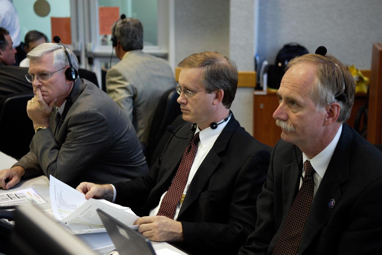 CAPE CANAVERAL, Fla. --  In the firing room at NASA's Kennedy Space Center, keeping track of the imminent launch of space shuttle Discovery on its STS-124 mission are (left to right) Michael Coats, director of NASA's Johnson Space Center, John Shannon, Shuttle Program manager, and Bill Gerstenmaier, associate administrator for Space Operations.  Discovery is making its 35th flight.  The STS-124 mission is the 26th in the assembly of the space station.  It is the second of three flights launching components to complete the Japan Aerospace Exploration Agency's Kibo laboratory.  The shuttle crew will install Kibo's large Japanese Pressurized Module and its remote manipulator system, or RMS.  The 14-day flight includes three spacewalks. Photo credit: NASA/Kim Shiflett