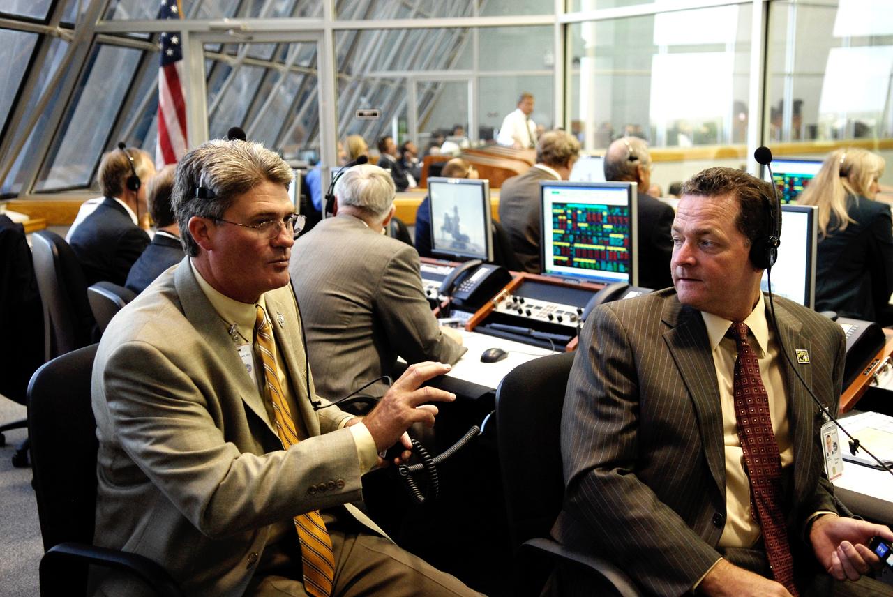 CAPE CANAVERAL, Fla. --  In the firing room, Bill Parsons (left), director of NASA's Kennedy Space Center, and Dave King, director of NASA's Marshall Space Flight Center, discuss the imminent launch of space shuttle Discovery on its STS-124 mission.  Discovery is making its 35th flight.  The STS-124 mission is the 26th in the assembly of the space station.  It is the second of three flights launching components to complete the Japan Aerospace Exploration Agency's Kibo laboratory.  The shuttle crew will install Kibo's large Japanese Pressurized Module and its remote manipulator system, or RMS.  The 14-day flight includes three spacewalks. Photo credit: NASA/Kim Shiflett