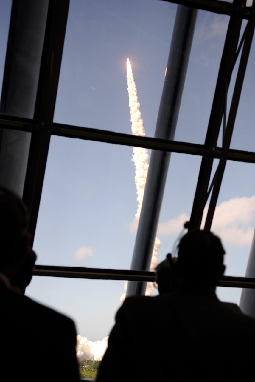 CAPE CANAVERAL, Fla. -- The launch of space shuttle Discovery on its STS-124 mission is seen through the windows of the firing room at NASA's Kennedy Space Center. Launch was on time at 5:02 p.m. EDT. Discovery is making its 35th flight. The STS-124 mission is the 26th in the assembly of the space station. It is the second of three flights launching components to complete the Japan Aerospace Exploration Agency's Kibo laboratory. The shuttle crew will install Kibo's large Japanese Pressurized Module and its remote manipulator system, or RMS. The 14-day flight includes three spacewalks. Photo credit: NASA/Kim Shiflett