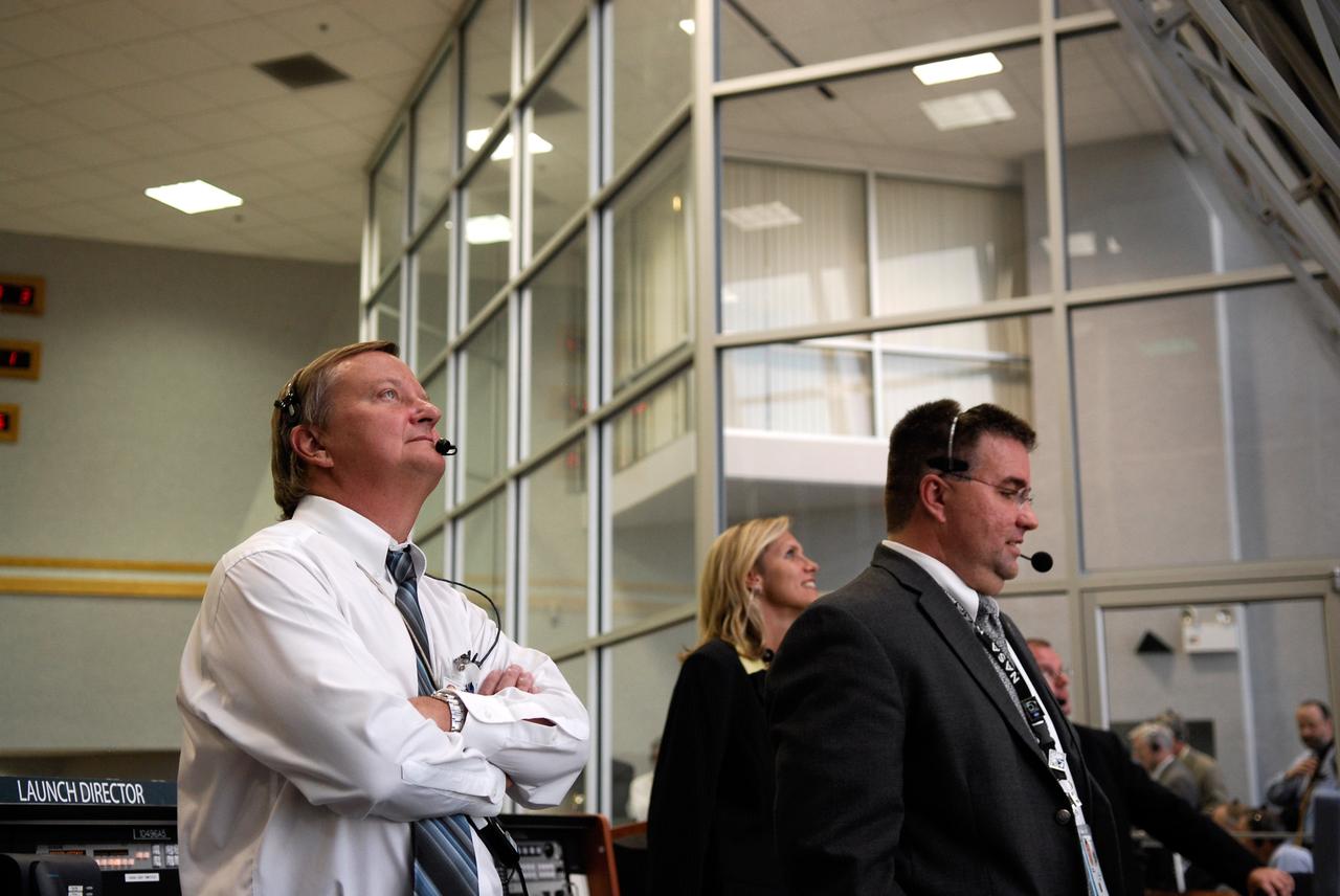 CAPE CANAVERAL, Fla. -- From the firing room, Shuttle Launch Director Mike Leinbach, NASA Flow Director Stephanie Stilson and Deputy Orbiter Project Manager Ed Mango from NASA's Johnson Space Center watch the successful launch of space shuttle Discovery.  Launch was on time at 5:02 p.m. EDT.  Discovery is making its 35th flight.  The STS-124 mission is the 26th in the assembly of the space station.  It is the second of three flights launching components to complete the Japan Aerospace Exploration Agency's Kibo laboratory.  The shuttle crew will install Kibo's large Japanese Pressurized Module and its remote manipulator system, or RMS.  The 14-day flight includes three spacewalks. Photo credit: NASA/Kim Shiflett