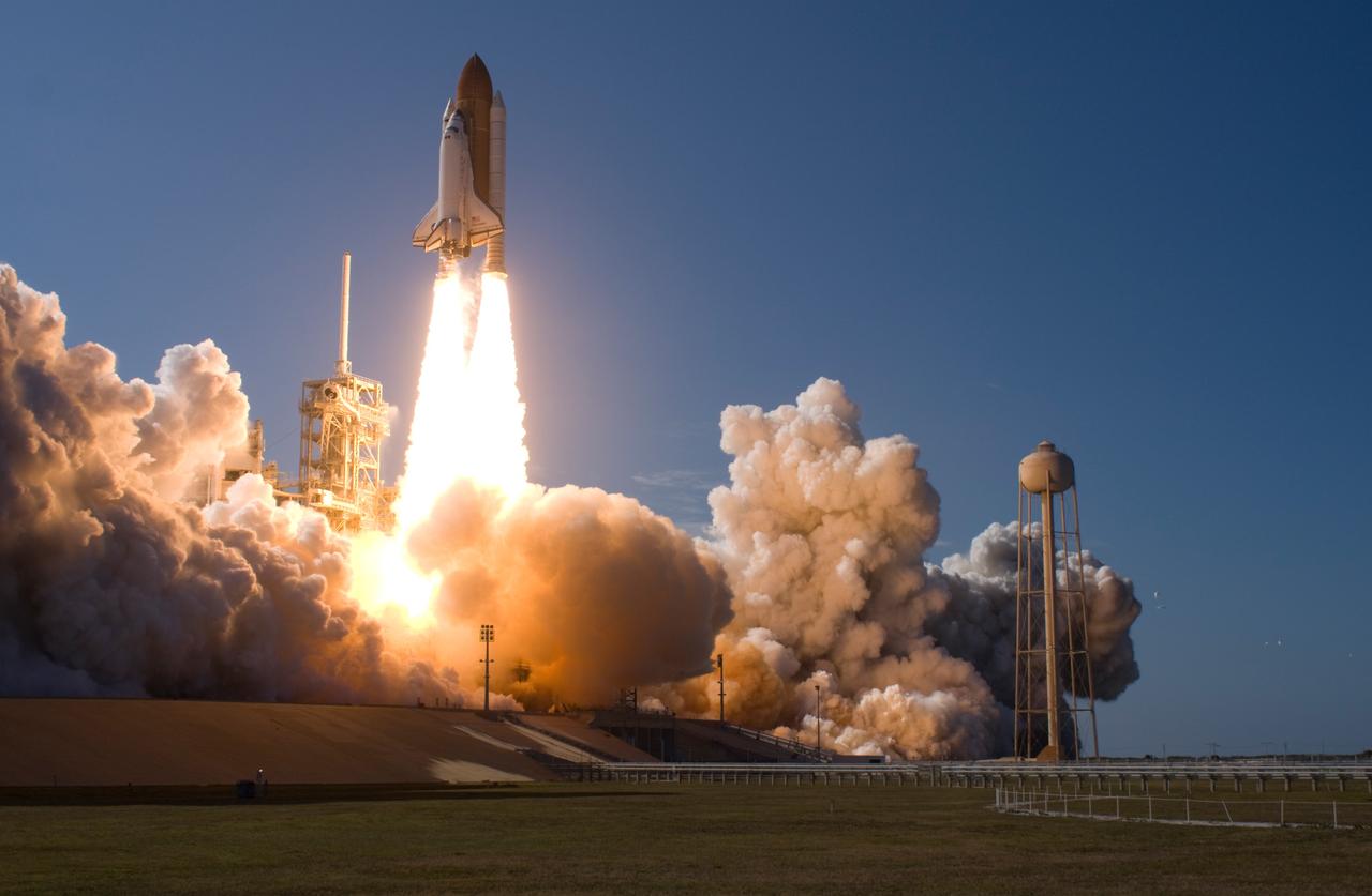 CAPE CANAVERAL, Fla. --   At NASA's Kennedy Space Center, smoke and steam billow across Launch Pad 39A as space shuttle Discovery races toward space atop twin towers of flame.  Launch was on time at 5:02 p.m. EDT. At right is the 300,000-gallon water tower that provides the water used for sound suppression on the pad during liftoff.  Discovery is making its 35th flight.  The STS-124 mission is the 26th in the assembly of the space station.  It is the second of three flights launching components to complete the Japan Aerospace Exploration Agency's Kibo laboratory.  The shuttle crew will install Kibo's large Japanese Pressurized Module and its remote manipulator system, or RMS.  The 14-day flight includes three spacewalks.  Photo courtesy of Scott Andrews