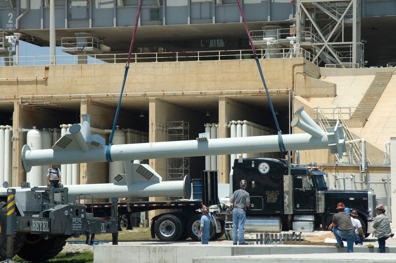CAPE CANAVERAL, Fla. -- On Launch Pad 39B at NASA's Kennedy Space Center, a crane lifts another part of the lightning mast to be erected on towers being built for the Constellation Program and Ares/Orion launches. Pad B will be the site of the first Ares vehicle launch, including Ares I-X which is scheduled for April 2009. Photo credit: NASA/Jim Grossmann