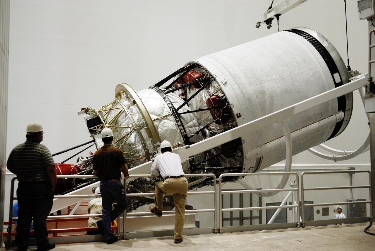 CAPE CANAVERAL, Fla. --   At Cape Canaveral Air Force Station, the second stage for the GOES-O Delta IV rocket is lifted from its horizontal position on the rotation stand.  Once vertical, the second stage will be moved into a work cell for processing. GOES – O is one of a series of Geostationary Operational Environmental Satellites. The multimission GOES series N-P will be a vital contributor to weather, solar, and space operations and science. NASA and the National Oceanic and Atmospheric Administration, or NOAA, are actively engaged in a cooperative program to expand the existing GOES system with the launch of the GOES N-P satellites.  Photo credit: NASA/Kim Shiflett
