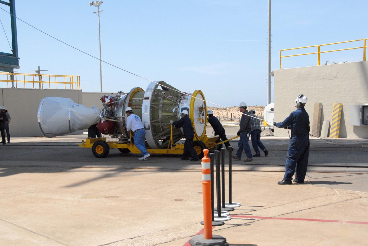VANDENBERG AIR FORCE BASE, Calif. --  Workers on Space Launch Complex 2 at Vandenberg Air Force Base in California maneuver the transporter with the Delta II second stage into place.  It will be lifted into the mobile service tower and installed on the first stage for launch of the OSTM/Jason-2 spacecraft. The OSTM, or Ocean Topography Mission, on the Jason-2 satellite is a follow-on to Jason-1. It will take oceanographic studies of sea surface height into an operational mode for continued climate forecasting research and science and industrial applications.  This satellite altimetry data will help determine ocean circulation, climate change and sea-level rise. OSTM is a joint effort by the National Oceanic and Atmospheric Administration, NASA, France’s Centre National d’Etudes Spatiales and the European Meteorological Satellite Organisation. OSTM/Jason-2 will be launched on June 20. Photo credit: NASA