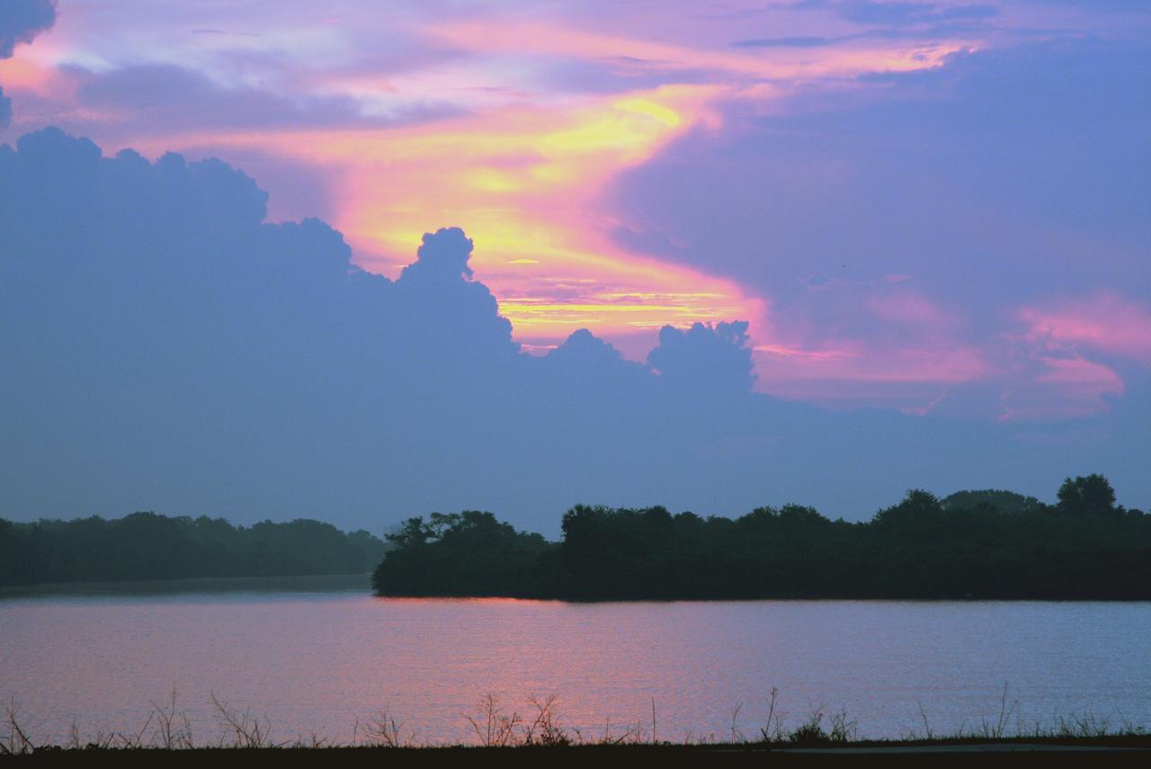 CAPE CANAVERAL, Fla.  –   Gathering clouds filter the painted sky over the turn basin in the Launch Complex 39 Area at NASA's Kennedy Space Center.  Photo credit: NASA/Dimitri Gerondidakis