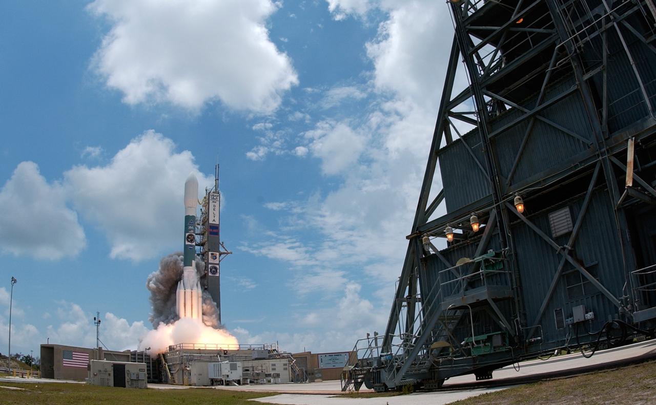CAPE CANAVERAL, Fla.  --  Under cloud-dotted blue sky, NASA's Gamma-Ray Large Area Space Telescope , or GLAST, blasts off from Cape Canaveral Air Force Station's Launch Pad 17-B aboard a Delta II rocket. Liftoff was at 12:05 p.m. EDT. GLAST is a powerful space observatory that will explore the universe's ultimate frontier, where nature harnesses forces and energies far beyond anything possible on Earth;  probe some of science's deepest questions, such as what our universe is made of, and search for new laws of physics; explain how black holes accelerate jets of material to nearly light speed; and help crack the mystery of stupendously powerful explosions known as gamma-ray bursts.  Launch is scheduled for 11:45 a.m. June 11.  Photo credit: NASA/Sandra Joseph, Kevin O'Connel
