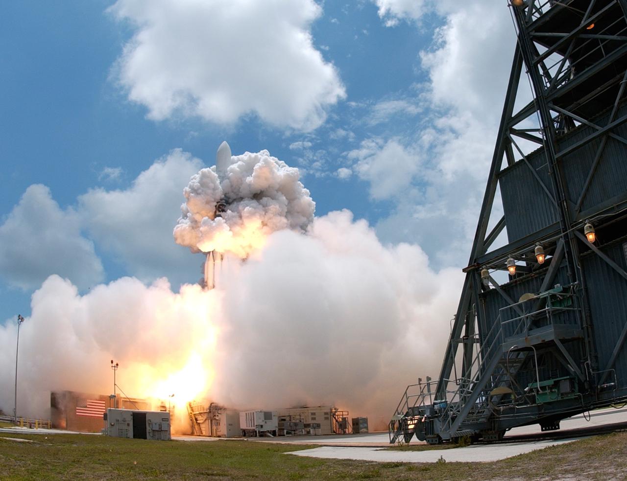 CAPE CANAVERAL, Fla.  --  The Delta II rocket with NASA's Gamma-Ray Large Area Space Telescope , or GLAST, on top is bathed in smoke just after liftoff from Cape Canaveral Air Force Station's Launch Pad 17-B. Liftoff was at 12:05 p.m. EDT. GLAST is a powerful space observatory that will explore the universe's ultimate frontier, where nature harnesses forces and energies far beyond anything possible on Earth;  probe some of science's deepest questions, such as what our universe is made of, and search for new laws of physics; explain how black holes accelerate jets of material to nearly light speed; and help crack the mystery of stupendously powerful explosions known as gamma-ray bursts.  Launch is scheduled for 11:45 a.m. June 11.  Photo credit: NASA/Sandra Joseph, Kevin O'Connel