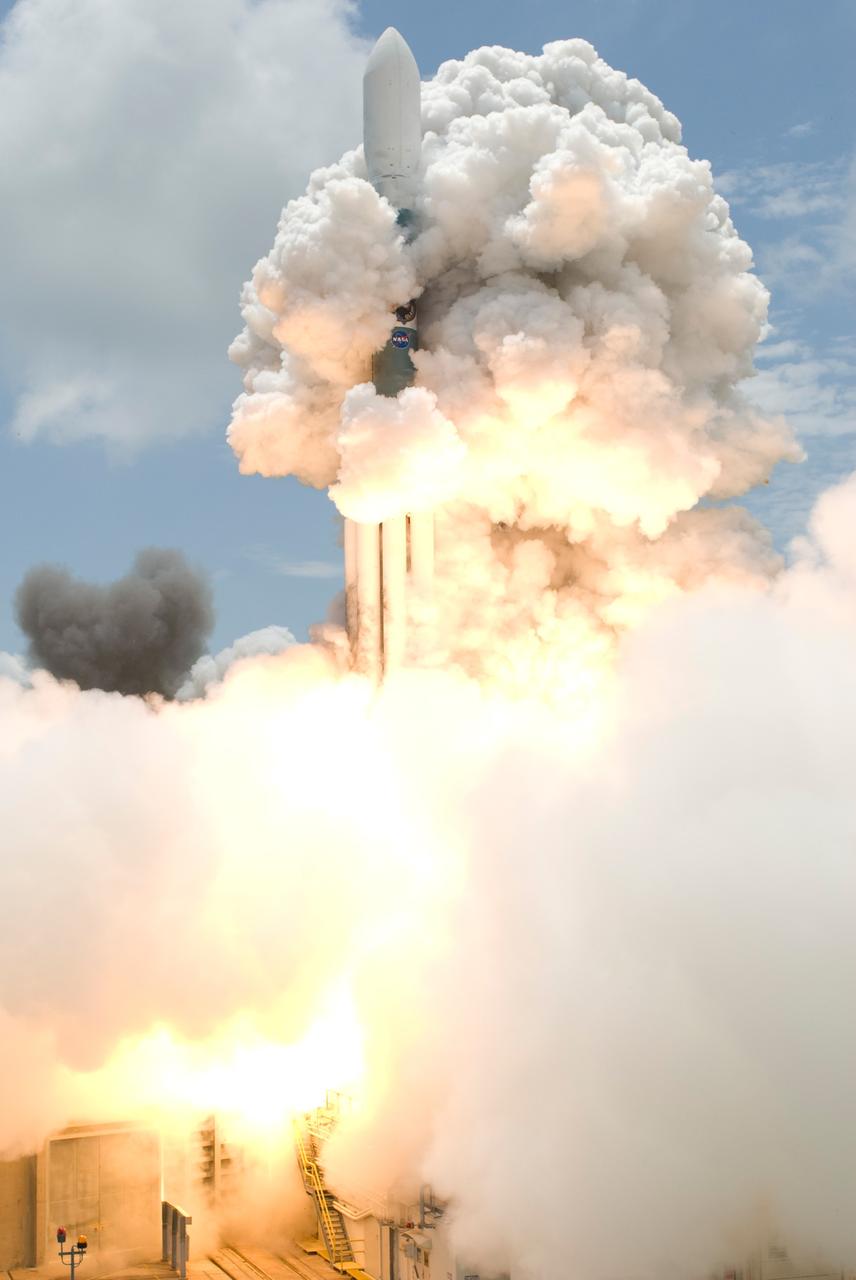 CAPE CANAVERAL, Fla.  --  Smoke envelops the Delta II rocket with NASA's Gamma-Ray Large Area Space Telescope , or GLAST, aboard as it launches from Cape Canaveral Air Force Station's Launch Pad 17-B. Liftoff was at 12:05 p.m. EDT.  GLAST is a powerful space observatory that will explore the universe's ultimate frontier, where nature harnesses forces and energies far beyond anything possible on Earth;  probe some of science's deepest questions, such as what our universe is made of, and search for new laws of physics; explain how black holes accelerate jets of material to nearly light speed; and help crack the mystery of stupendously powerful explosions known as gamma-ray bursts.  Launch is scheduled for 11:45 a.m. June 11.  Photo credit: NASA/Jerry Cannon, Robert Murray