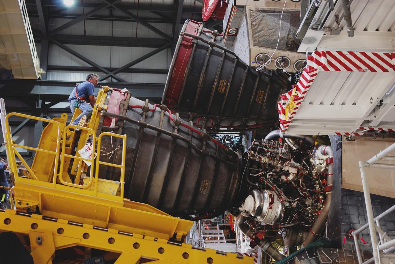 CAPE CANAVERAL, Fla. – In Orbiter Processing Facility bay No. 1, one of the three main engines for space shuttle Atlantis is poised for installation.  Main engine No. 1 has already been installed.  Atlantis is the designated vehicle for the STS-125 mission to service the Hubble Space Telescope.  Launch is targeted for Oct. 8.  Photo credit: NASA/Kim Shiflett