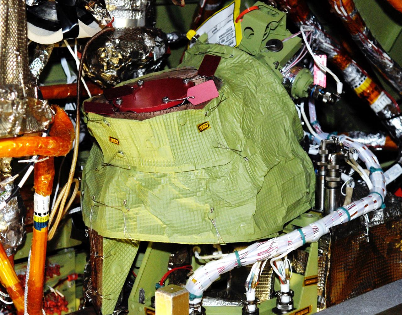 CAPE CANAVERAL, Fla. – In Orbiter Processing Facility bay No. 2, auxiliary power unit 3, or APU3, is in place on space shuttle Endeavour for the STS-126 mission.  The auxiliary power unit is a hydrazine-fueled, turbine-driven power unit that generates mechanical shaft power to drive a hydraulic pump that produces pressure for the orbiter's hydraulic system. There are three separate APUs, three hydraulic pumps and three hydraulic systems, located in the aft fuselage of the orbiter. When the three auxiliary power units are started five minutes before lift-off, the hydraulic systems are used to position the three main engines for activation, control various propellant valves on the engines and position orbiter aerosurfaces.  The auxiliary power units are not operated after the first orbital maneuvering system thrusting period because hydraulic power is no longer required. One power unit is operated briefly one day before deorbit to support checkout of the orbiter flight control system.  One auxiliary power unit is restarted before the deorbit thrusting period. The two remaining units are started after the deorbit thrusting maneuver and operate continuously through entry, landing and landing rollout.  On STS-126, Endeavour will deliver a multi-purpose logistics module to the International Space Station. Launch is targeted for Nov. 10.  Photo credit: NASA/Kim Shiflett