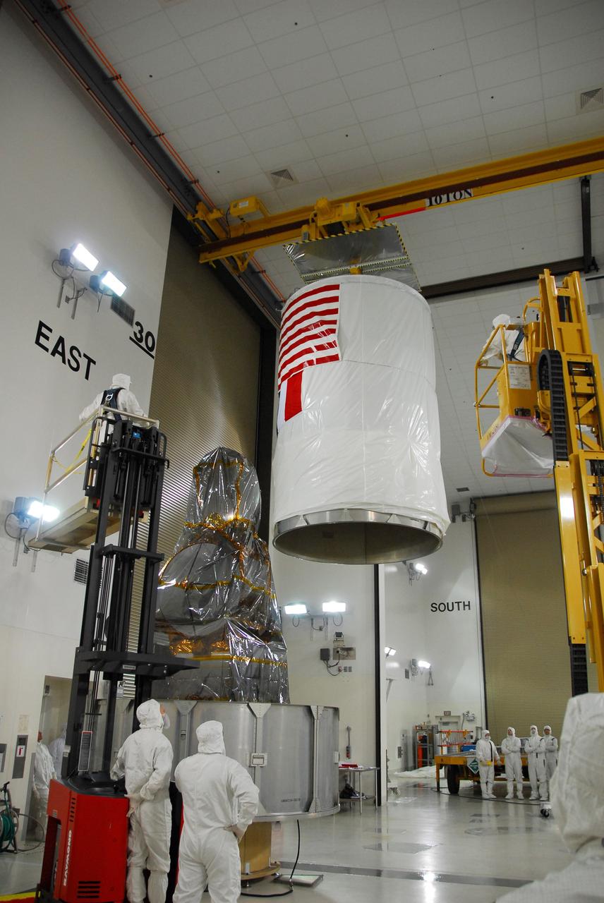 VANDENBERG AIR FORCE BASE, Calif. – The upper canister cylinder is moved toward the wrapped Ocean Surface Topography Mission, or OSTM/Jason 2, spacecraft. Once the canister is fully in place, the OSTM/Jason 2 will be transported to the launch pad. The launch of the OSTM/Jason 2 aboard a Delta II rocket is scheduled for Friday, June 20, from Vandenberg Air Force Base in California. The launch window extends from 12:46 a.m. to 12:55 a.m. PDT. The satellite will be placed in an 830-mile-high orbit at an inclination of 66 degrees after separating from the Delta II 55 minutes after liftoff. The five primary science instruments of the Ocean Surface Topography Mission aboard the Jason 2 spacecraft are dedicated to measuring ocean surface height. These measurements will be used to evaluate and forecast climate changes and improve weather forecasting. The results also are expected to help forecasters better predict hurricane intensity. Photo credit: NASA/Dan Liberotti
