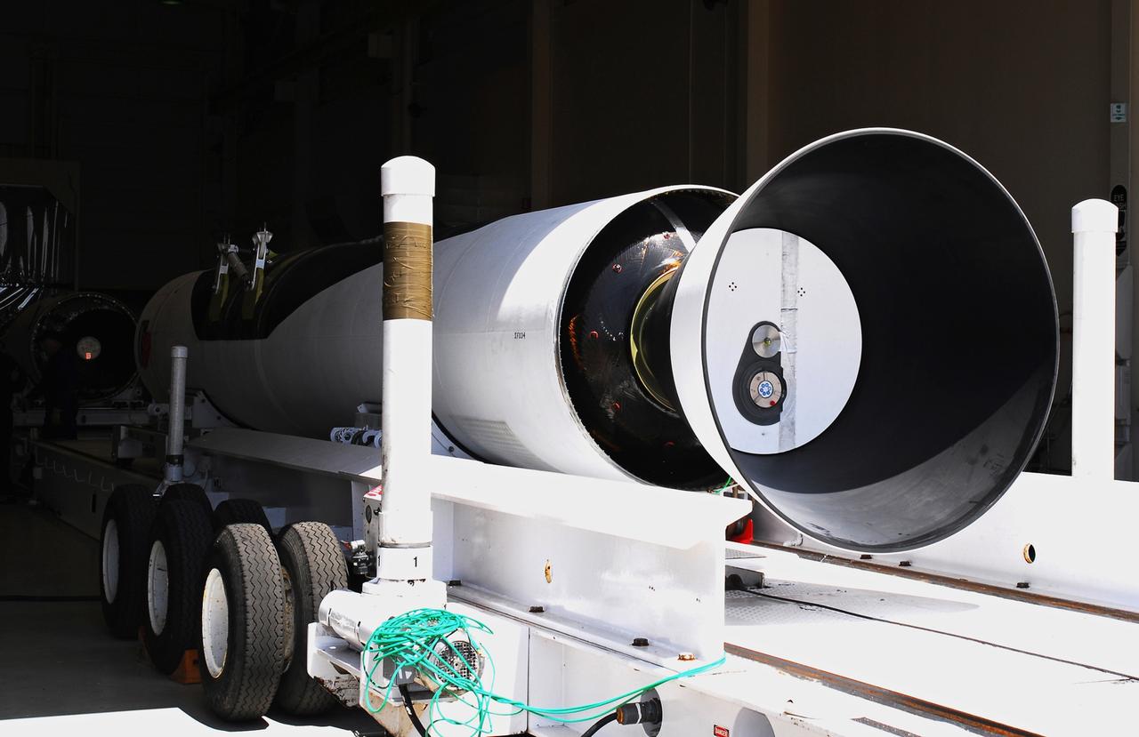 VANDENBERG AIR FORCE BASE, Calif. – Segments of the Pegasus XL launch vehicle are moved into Building 1555. The Pegasus will launch NASA's Interstellar Boundary Explorer Mission, or IBEX, satellite from Kwajalein Island in the Marshall Islands, South Pacific. IBEX will make the first map of the boundary between the solar system and interstellar space. IBEX is the first mission designed to detect the edge of the solar system. As the solar wind from the sun flows out beyond Pluto, it collides with the material between the stars, forming a shock front. IBEX contains two neutral atom imagers designed to detect particles from the termination shock at the boundary between the solar system and interstellar space. IBEX also will study galactic cosmic rays, energetic particles from beyond the solar system that pose a health and safety hazard for humans exploring beyond Earth orbit. IBEX will make these observations from a highly elliptical orbit that takes it beyond the interference of the Earth's magnetosphere. Photo credit: NASA/Moran