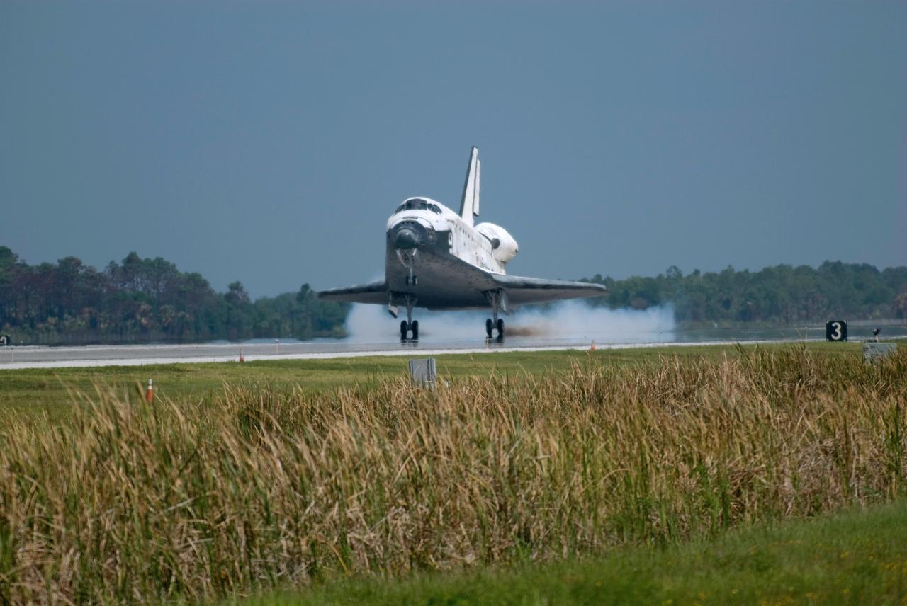 CAPE CANAVERAL, Fla. – In the 69th landing at NASA's Kennedy Space Center, space shuttle Discovery kicks up dust as it touches down on Runway 15 to end the STS-124 mission, a 14-day flight to the International Space Station. The main landing gear touched down at 11:15:19 a.m. EDT. The nose landing gear touched down at 11:15:30 a.m. and wheel stop was at 11:16:19 a.m. The mission completed 5.7 million miles. The STS-124 mission delivered the Japan Aerospace Exploration Agency's large Japanese Pressurized Module and its remote manipulator system to the space station. Photo credit: NASA/Chris Lynch