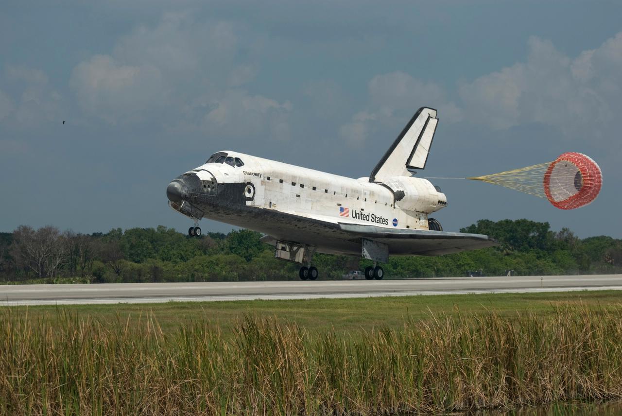 CAPE CANAVERAL, Fla.  –  In the 69th landing at NASA's Kennedy Space Center, a drag chute slows space shuttle Discovery's landing on Runway 15 to end the STS-124 mission, a 14-day flight to the International Space Station. The main landing gear touched down at 11:15:19 a.m. EDT. The nose landing gear touched down at 11:15:30 a.m. and wheel stop was at 11:16:19 a.m. The mission completed 5.7 million miles. The STS-124 mission delivered the Japan Aerospace Exploration Agency's large Japanese Pressurized Module and its remote manipulator system to the space station.   Photo credit: NASA/Chris Lynch
