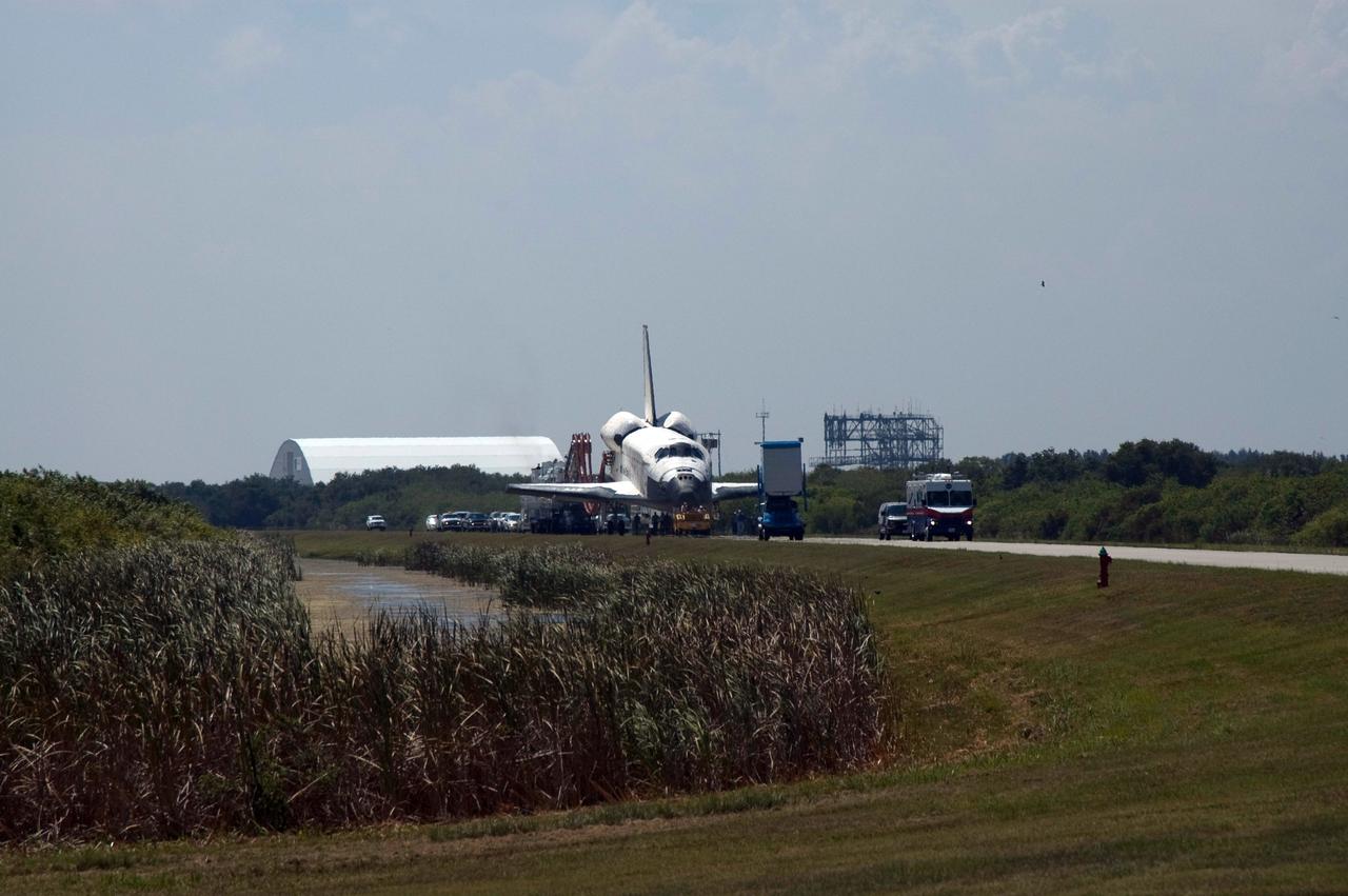 CAPE CANAVERAL, Fla. – Space shuttle Discovery is towed from the Shuttle Landing Facility at NASA's Kennedy Space Center. Discovery's landing ended the 14-day, STS-124 mission to the International Space Station. The STS-124 mission delivered the Japan Aerospace Exploration Agency's large Japanese Pressurized Module and its remote manipulator system to the space station. The landing was on time at 11:15 a.m. EDT. Photo credit: NASA/Jim Grossmann