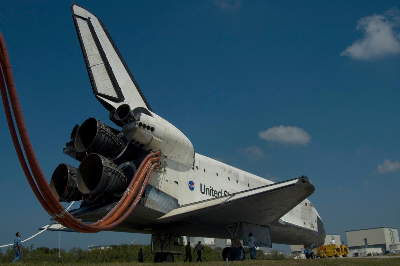CAPE CANAVERAL, Fla. – With umbilical lines still attached, space shuttle Discovery is towed from the Shuttle Landing Facility at NASA's Kennedy Space Center. Discovery's landing ended the 14-day, STS-124 mission to the International Space Station. The STS-124 mission delivered the Japan Aerospace Exploration Agency's large Japanese Pressurized Module and its remote manipulator system to the space station. The landing was on time at 11:15 a.m. EDT. Photo credit: NASA/Jim Grossmann