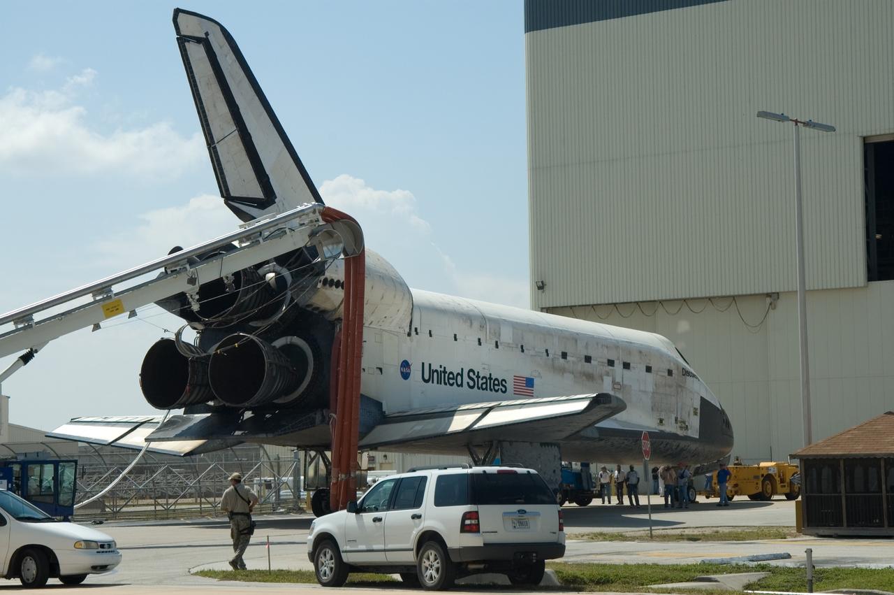 CAPE CANAVERAL, Fla. – With umbilical lines still attached, space shuttle Discovery is towed toward bay No. 3 at the Orbiter Processing Facility at NASA's Kennedy Space Center. Discovery landed on Runway 15 to end the 14-day, STS-124 mission to the International Space Station. The STS-124 mission delivered the Japan Aerospace Exploration Agency's large Japanese Pressurized Module and its remote manipulator system to the space station. The landing was on time at 11:15 a.m. EDT. Photo credit: NASA/Jim Grossmann