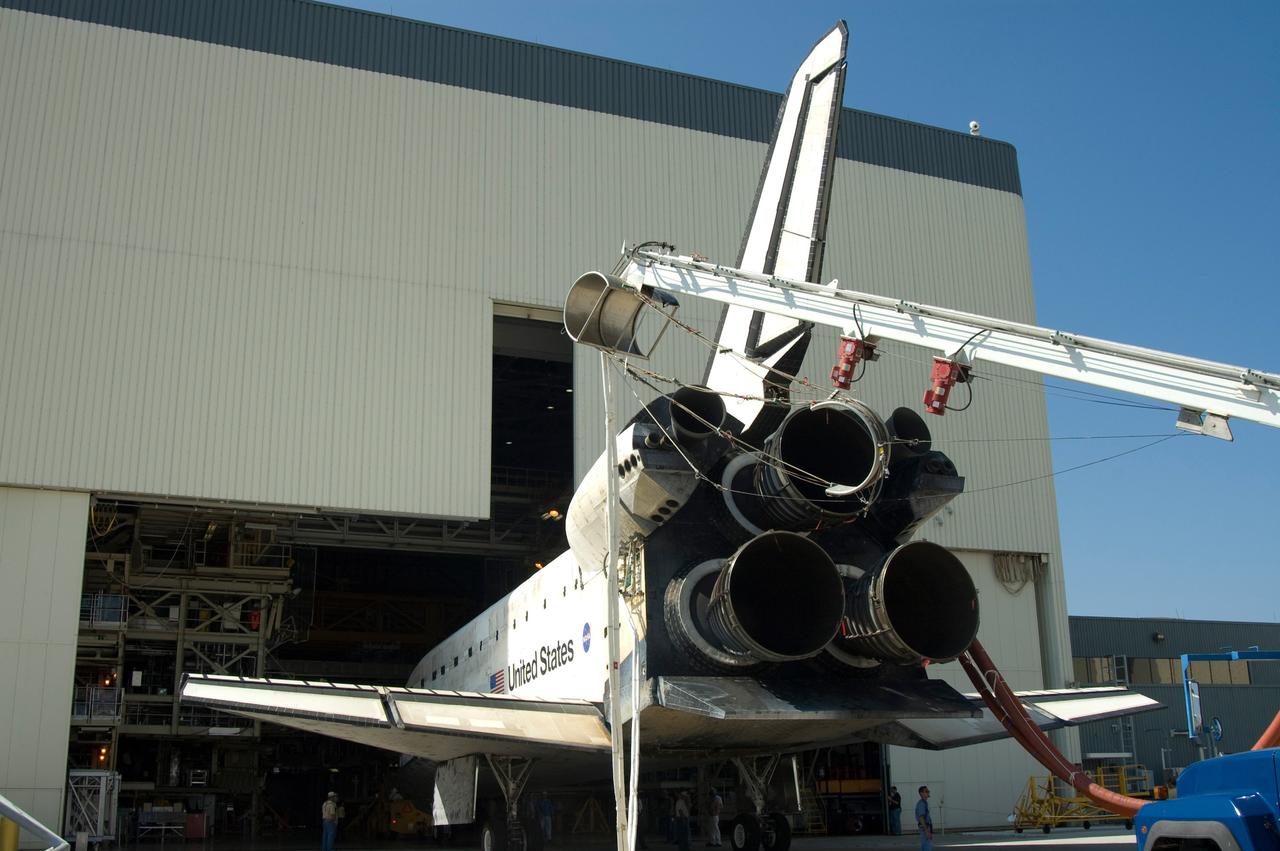 CAPE CANAVERAL, Fla. – Space shuttle Discovery is towed into bay No. 3 at the Orbiter Processing Facility at NASA's Kennedy Space Center. Discovery landed on Runway 15 to end the 14-day, STS-124 mission to the International Space Station. The STS-124 mission delivered the Japan Aerospace Exploration Agency's large Japanese Pressurized Module and its remote manipulator system to the space station. The landing was on time at 11:15 a.m. EDT. Photo credit: NASA/Jim Grossmann