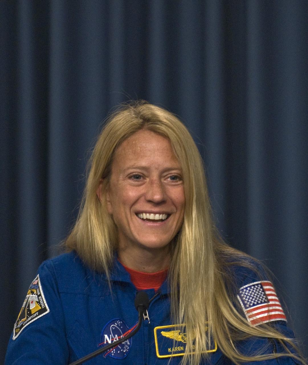 CAPE CANAVERAL, Fla. – Following the successful landing of space shuttle Discovery at NASA's Kennedy Space Center to end the 14-day, STS-124 mission, the crew sits for a press conference. Mission Specialist Karen Nyberg describes her favorite moment in space. The STS-124 mission delivered the Japan Aerospace Exploration Agency's large Japanese Pressurized Module and its remote manipulator system to the International Space Station. The landing was on time at 11:15 a.m. EDT. Photo credit: NASA/Kim Shiflett