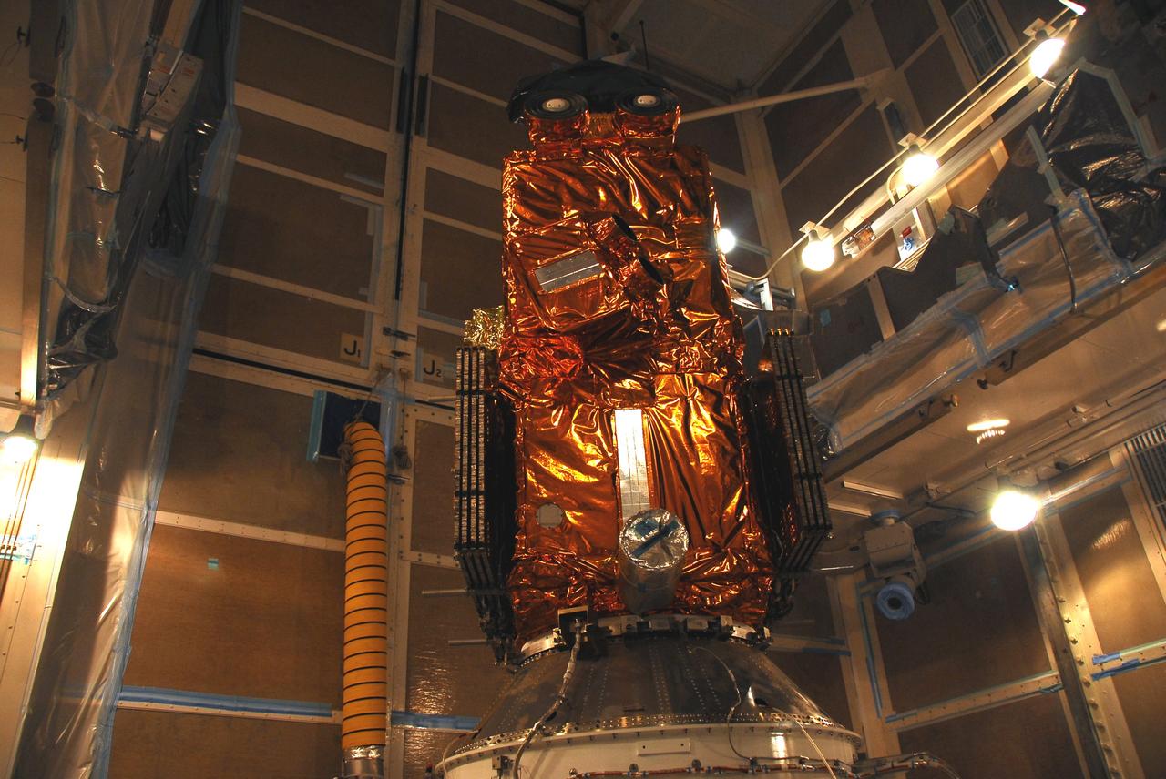 VANDENBERG AIR FORCE BASE, Calif. –   In the mobile service tower on Space Launch Complex 2, the Ocean Surface Topography Mission, or OSTM/Jason 2, spacecraft is ready for encapsulation in the fairing.  The fairing is a molded structure that fits flush with the outside surface of the Delta II upper stage booster and forms an aerodynamically smooth nose cone, protecting the spacecraft during launch and ascent. The launch of the OSTM/Jason-2 is scheduled for June 20 from Vandenberg Air Force Base. The launch window extends from 12:46 a.m. to 12:55 a.m. PDT. The satellite will be placed in an 830-mile-high orbit at an inclination of 66 degrees after separating from the Delta II 55 minutes after liftoff.  The five primary science instruments of the Ocean Surface Topography Mission aboard the Jason 2 spacecraft are dedicated to measuring the height of the ocean surface. These measurements will be used to evaluate and forecast climate changes and improve weather forecasting. The results also are expected to help forecasters better predict hurricane intensity.