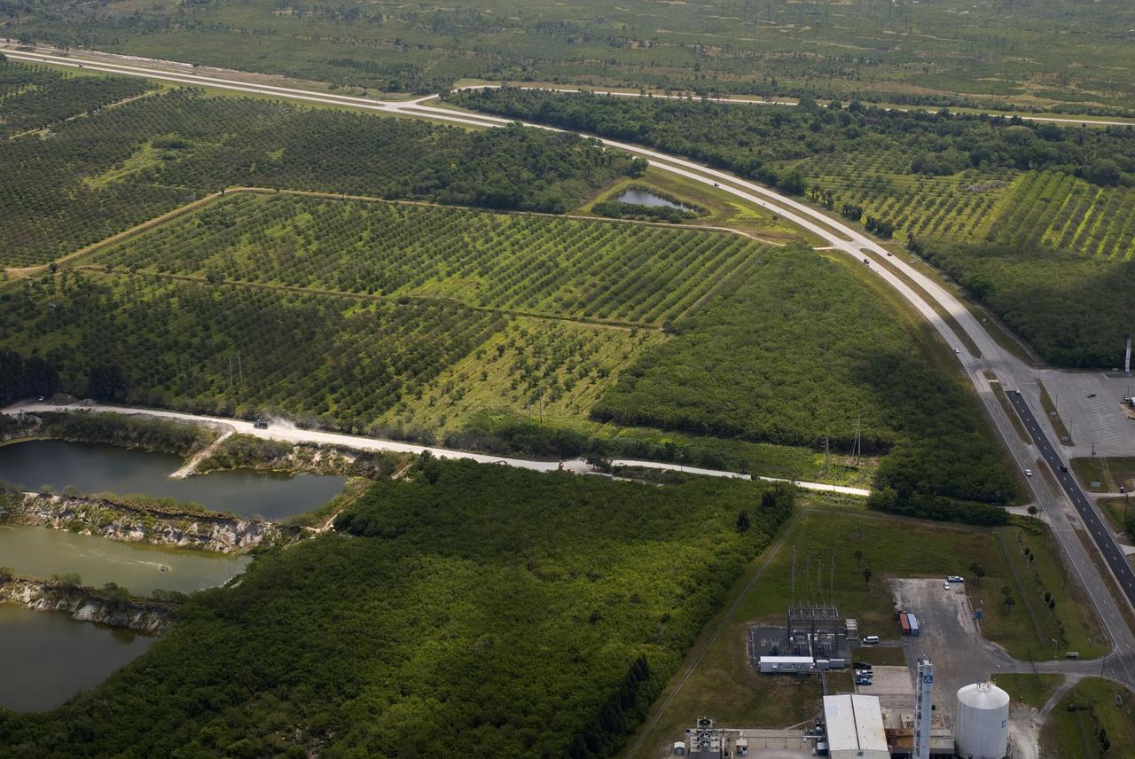 CAPE CANAVERAL, Fla.  –    This photo shows the area within NASA's Kennedy Space Center where a solar photovoltaic power generation system will be built as the result of an agreement between NASA and Florida Power & Light.  The agreement is part of a new initiative that will cut reliance on fossil fuels and improve the environment by reducing greenhouse gas emissions.  The major facility will produce an estimated 10 megawatts of electrical power, which can serve roughly 3,000 homes.  A separate one-megawatt solar power facility will support the electrical needs of the center.