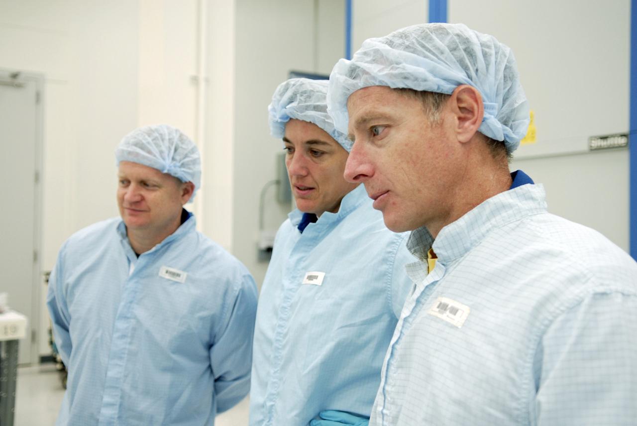 CAPE CANAVERAL, Fla.  –  In the Space Station Processing Facility at NASA's Kennedy Space Center, STS-126 Pilot Eric Boe, Mission Specialist Heidemarie M. Stefanyshyn-Piper and Commander Christopher Ferguson look over equipment that will fly on the mission.  Shuttle crews frequently visit Kennedy  to get hands-on experience, called a crew equipment interface test, with hardware and equipment for their missions.  On STS-126, Endeavour will deliver a multi-purpose logistics module to the International Space Station. Launch is targeted for Nov. 10.   Photo credit: NASA/Kim Shiflett